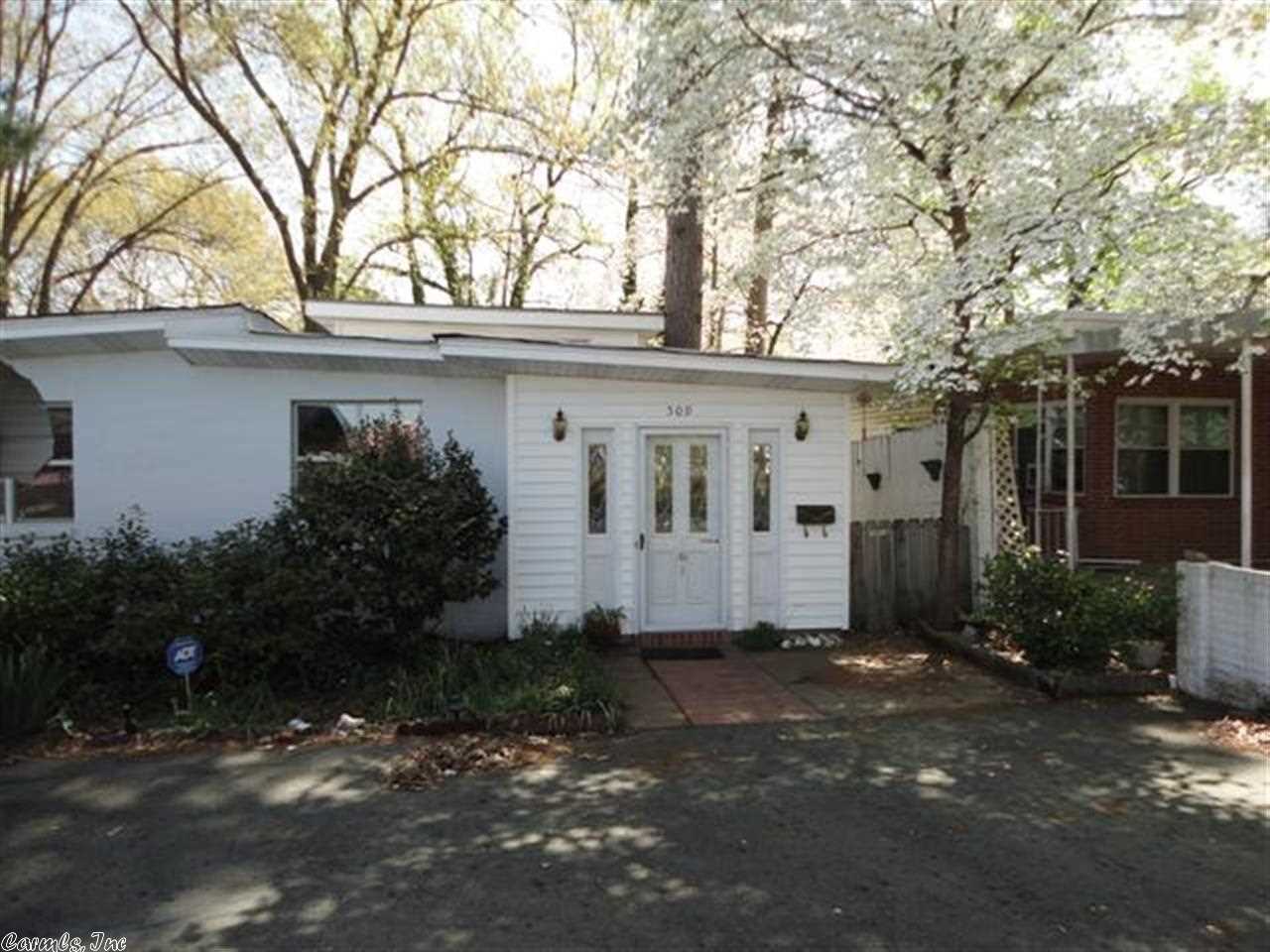 A drive by of this home won't do!  Must see the interior of this uniquely remodeled home with so many special features!  Beautiful original wood floors, professionally decorated with gorgeous paint colors, foyer-sitting room, great room with an abundance of natural light from the high windows along the walls, wood open-beamed ceilings, oversized formal dining room, kitchen w/ roomy breakfast area, large laundry room, master bedroom adjoining the screened porch, & cellar!  Bypass to I-30 less than 1 mile!