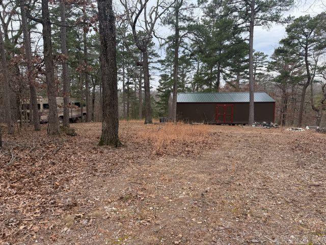 20± acres of unrestricted land featuring mature hardwood timber, abundant wildlife, and a 16x40 unfinished cabin ready for your vision. Electric is already on site, saving time and expense. Enjoy county road frontage for easy access and privacy, all while being just minutes from the lake. Ideal for a weekend retreat, hunting property, future homesite, or investment opportunity. Endless potential with no restrictions—bring your RV, build, or enjoy as-is!