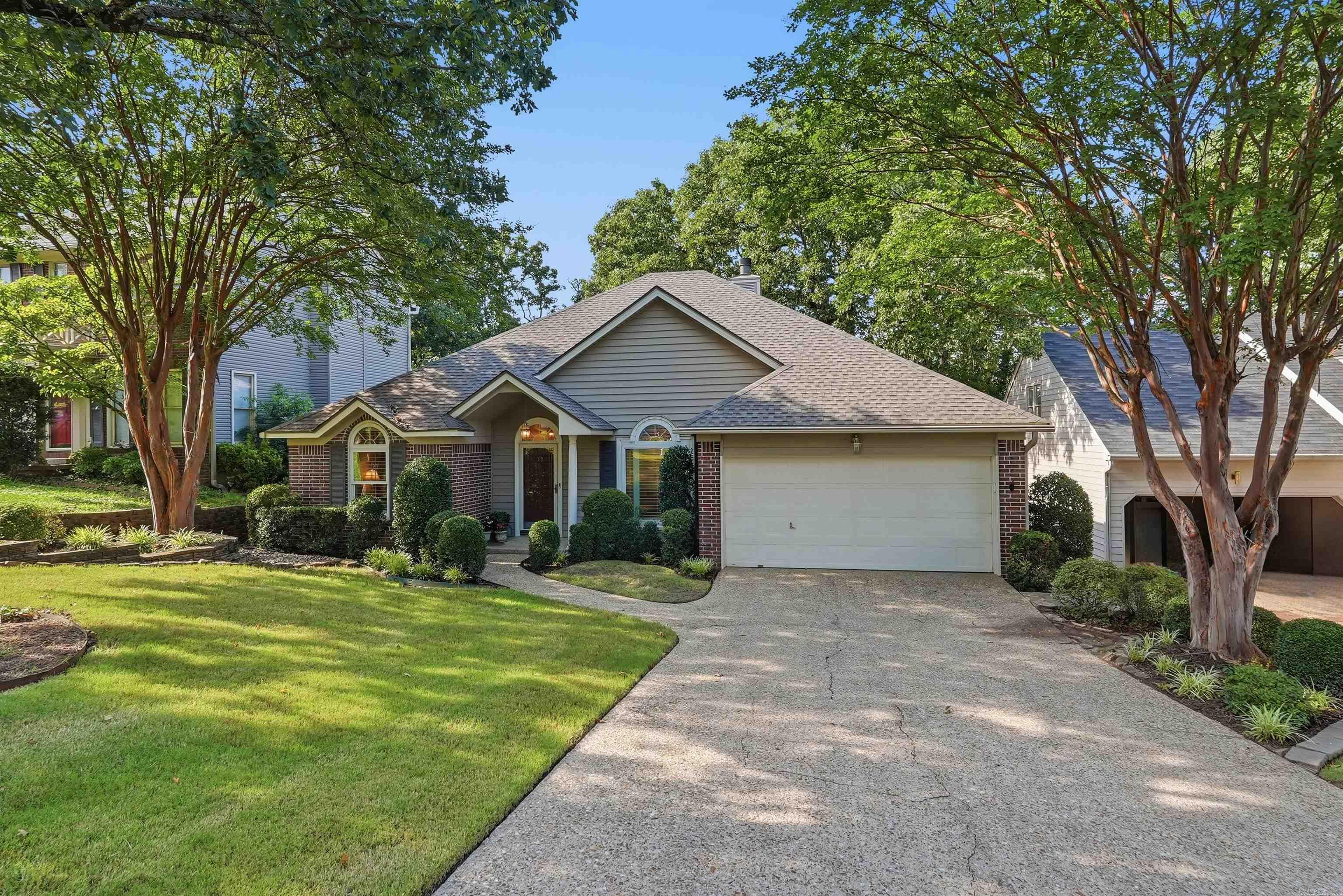 Welcome to this pristine one-level charmer, conveniently located near shopping, restaurants & schools! This beautifully maintained 3 bed/2 bath home offers a thoughtful layout designed for comfort & gatherings. Custom 3 ½" plantation shutters throughout and 5" Hartco pecan hardwood flooring elevate the feel of the home. The living room features a gas log fireplace & custom built-in bookcases. This home has plenty of storage and a flex room that can be used as a sitting area, office or dining. The updated kitchen is light-filled & spacious, w/ newer ss appliances, Cambria quartz counters, tile backsplash, glass cooktop, a large island & a generous eat-in area. Refrigerator stays. The primary suite has custom shutters & an updated bath with newer cabinetry/counters, Kohler faucets, a tiled shower with frameless clear glass doors, double walk-in closets & an oversized 70x40 mirror. Enjoy the private, shaded, park-like backyard from the large deck overlooking a gardener’s oasis. Garden shed w/ electricity & designed to match the home's exterior. Andersen windows, sprinkler systm front/back, LeafGuard gutters, roof 2025, HVAC 2009, water heater 2011. It's even more beautiful in person!