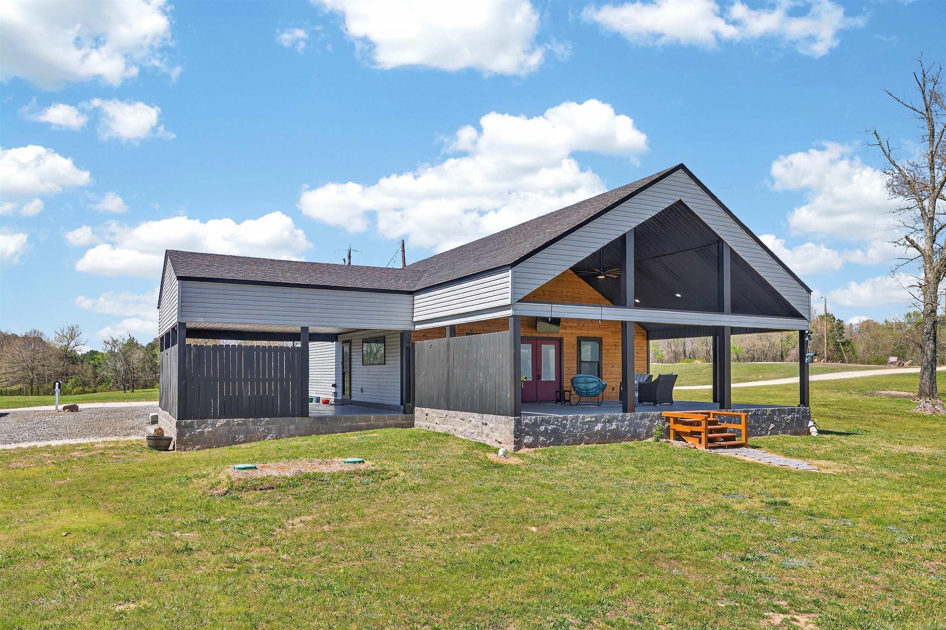 If you've been dreaming of peaceful country living with room to spread out, this move-in-ready home is a must-see! Built in 2022, this 2-bedroom, 2-bath home sits on 4.57 beautiful acres and offers the perfect blend of modern comfort and country charm. Inside, you'll find an open floor plan with a spacious loft that provides flexible space for a home office, guest area, or recreation room. Step outside and enjoy your own private stocked pond, where you can spend mornings with a cup of coffee or evenings fishing while taking in the peaceful surroundings. With plenty of room to enjoy the outdoors, this property offers the privacy and space you've been looking for, all while being move-in ready. Don't miss the opportunity to make this beautiful Arkansas property your own. Schedule your private showing today!