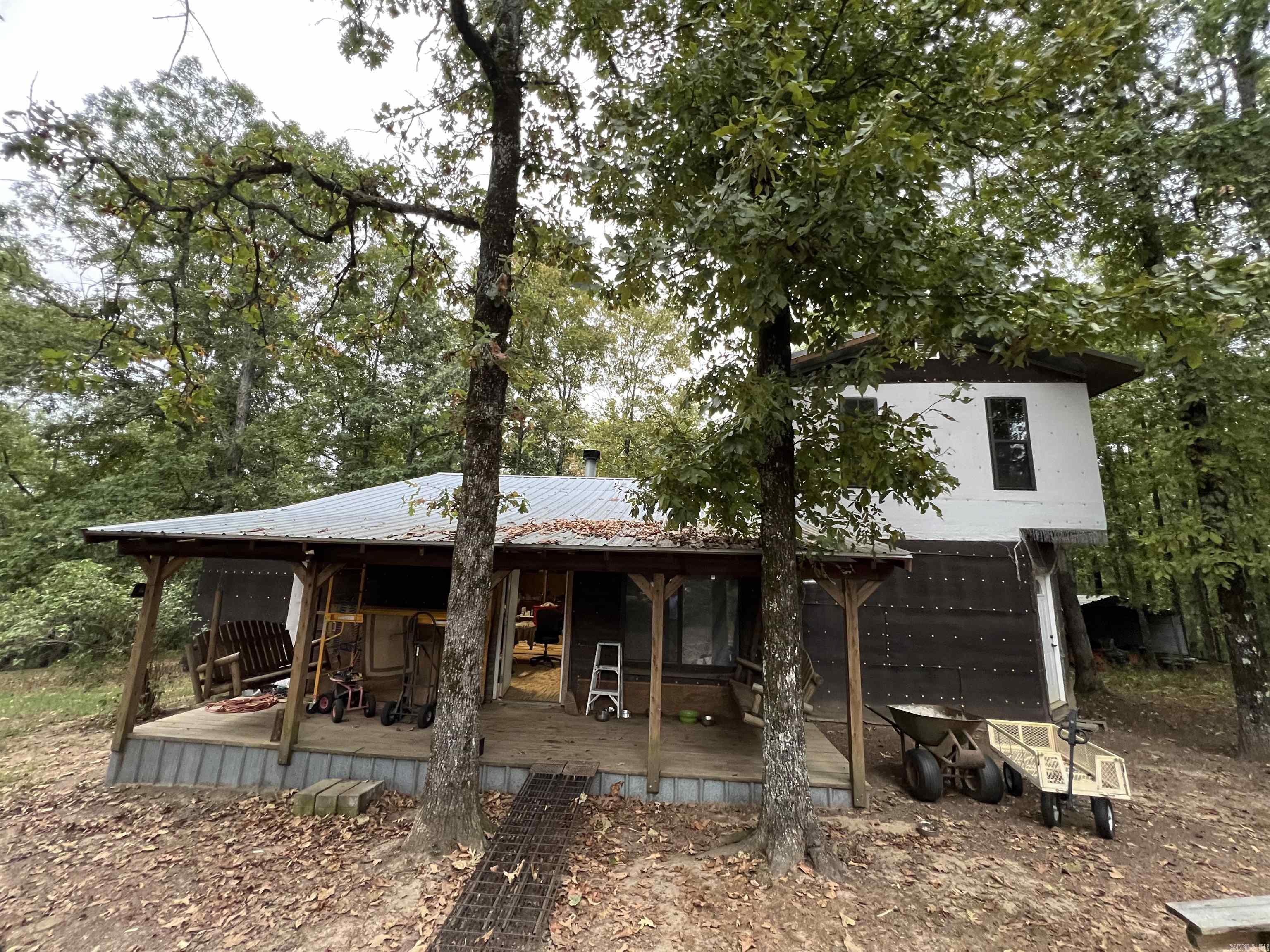 Great project home on 10 acres with several out buildings. This home is ready for the new owners to complete a previous family's remodel dream. The home has just about everything needed to finish the home; including rough cut lumber, roof & siding tin, wood working tools, and much more! Quite and peaceful mountain setting.
