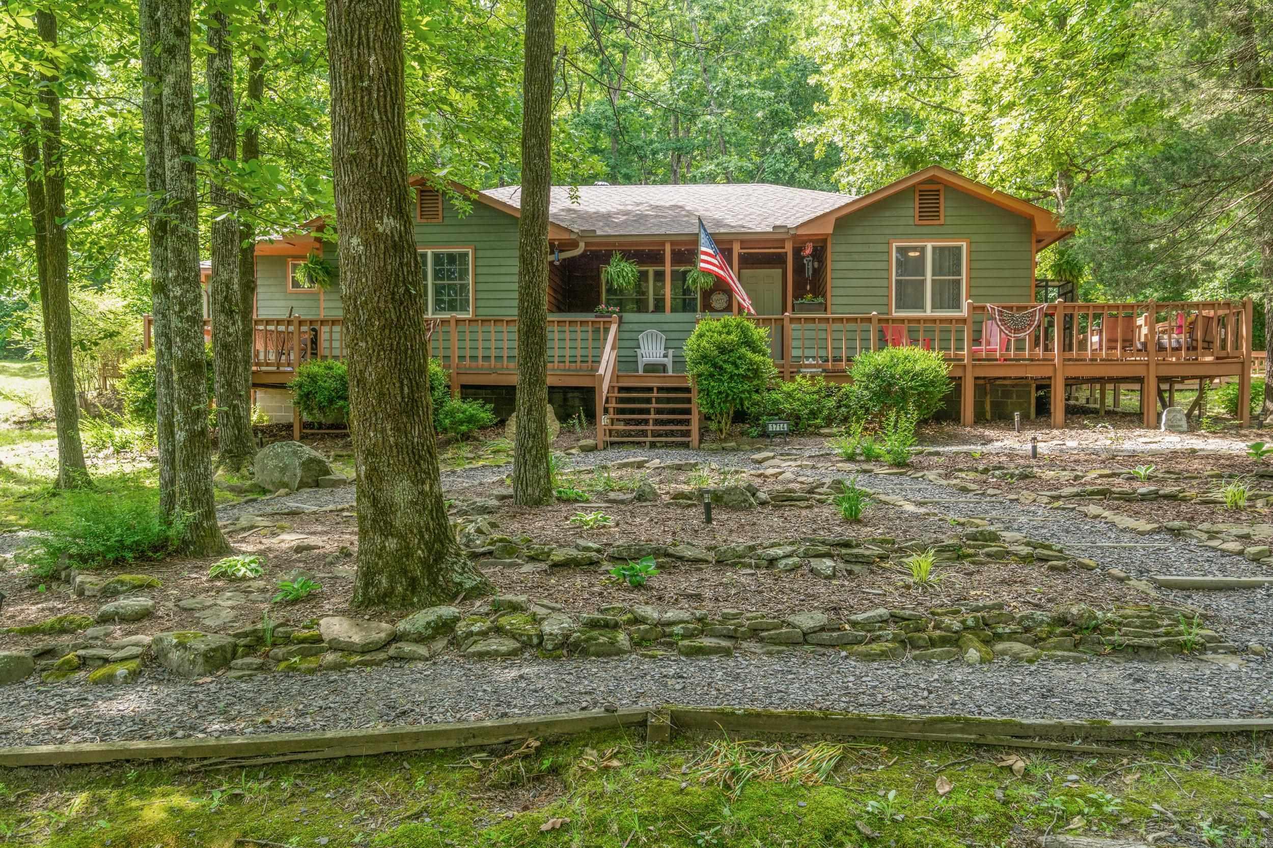 Open Space, Woods, and Room to Breathe! Enjoy this beautiful 4 bedroom, 2 bath home situated on 17 beautiful acres just off Libby Road. A winding drive leads up to the home, opening into a peaceful hilltop setting with a great mix of cleared land and sloped wooded acreage.  With 1,915 square feet, this home offers space to spread out both inside and out. Enjoy the outdoors from the beautiful decking overlooking the property, perfect for relaxing or entertaining. The detached 3 car garage/shop provides plenty of room for vehicles, storage, hobbies, or workspace.  The property is beautifully landscaped and offers a private setting with open views, mature trees, and room to enjoy country living while still being convenient to town. Agents, please see showing remarks for the door code.