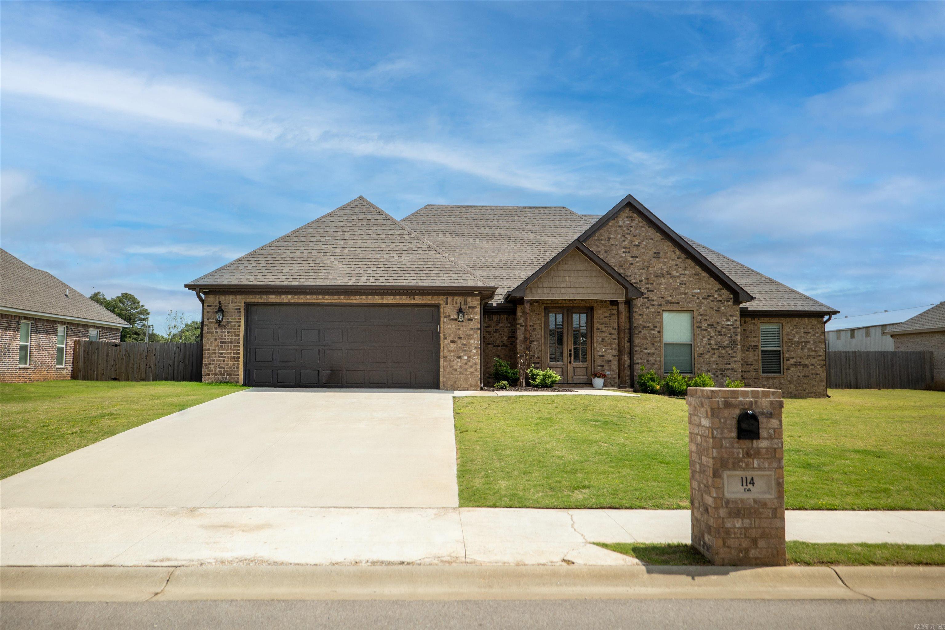New listing in the highly sought-after Whispering Hills subdivision! This 4-bedroom, 2-bath home features durable LVP flooring throughout, granite countertops, and classic white shaker cabinetry. You’ll love the split floor plan, offering a private primary suite separated from the additional bedrooms for added comfort and functionality. The spacious kitchen is equipped with stainless steel appliances, an extra-large pantry, and flows seamlessly into the living area, highlighted by a stunning floor-to-ceiling shiplap fireplace with an electric insert. You’ll love the oversized primary closet, generous laundry room, and convenient built-in locker system just off the garage. Step outside to a covered back patio that overlooks the large, fenced-in backyard—perfect for relaxing or entertaining. Enjoy a convenient location in the Brookland School District, just minutes from everything you need! This home offers both style and functionality with thoughtful details inside and out!