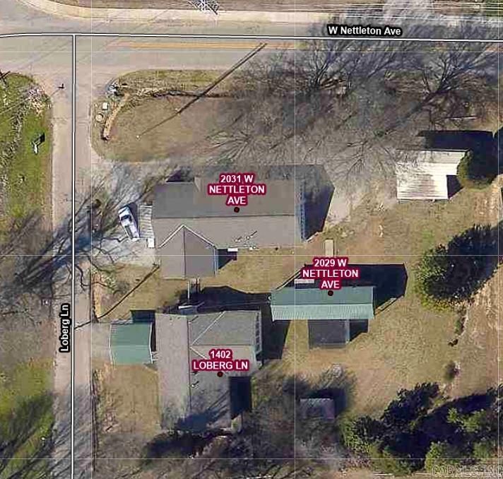 Unique investment opportunity featuring three separate dwelling units on approximately 1 acre m/l, ideally situated on a corner lot within city limits and just 0.4 mile from the junior high school. The main home at 1402 Loberg offers 1,620 sq. ft. with 3 bedrooms, 1.5 baths, a living room, den, eat-in kitchen with island and bar, and an oversized sunroom. Brick exterior with covered patio. The metal carport at this house will not convey.  Second dwelling at 2031 W Nettleton includes 1,170 sq. ft., 2 bedrooms, 1 bath, large living area, galley kitchen, plus an attached 900 sq. ft. garage/workshop and additional 1-car garage. Living space needs TLC. The metal porch facing Loberg will not convey. Third unit at 2029 W Nettleton is a mobile home with 720 sq. ft. plus a 256 sq. ft. addition, featuring a secondary metal roof for added protection and efficiency. Property also includes an above-ground storm shelter and double metal carport. Two units currently leased, offering immediate income potential. Sold as-is.
