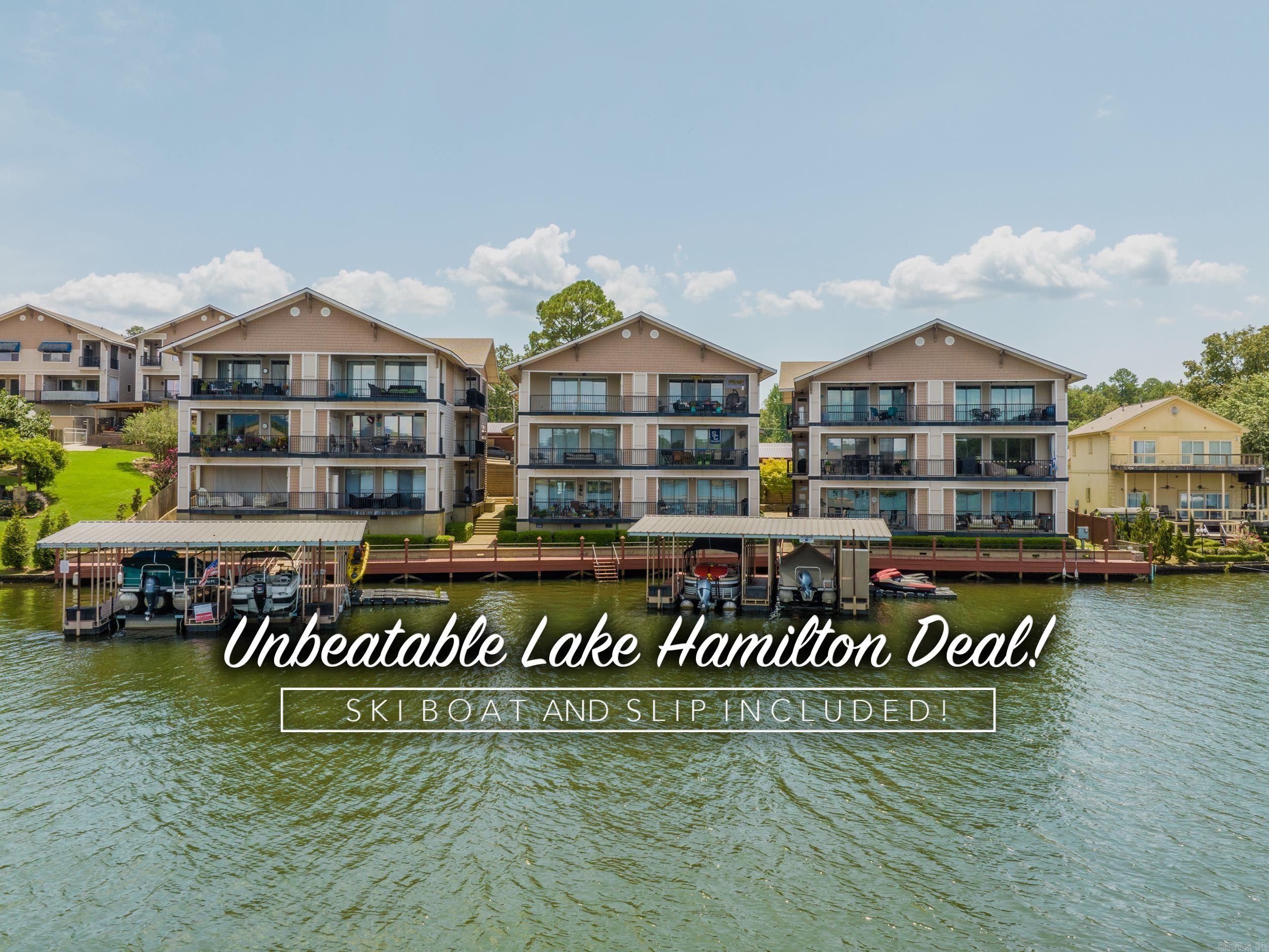 Unbeatable deal on Lake Hamilton – Boat AND Slip Included! This is the best deal currently available on a condo at Lake Hamilton—don’t miss your opportunity to own in the prestigious, gated Bel Lago community. Enjoy luxury lakefront living in a private, beautifully landscaped, and secure setting overlooking the shimmering waters of Lake Hamilton. This condo features steel construction, an oversized garage, a separate workshop, AND an interior elevator for convenience across all levels. The main floor showcases a spacious living area, dining space, and a gourmet kitchen complete with granite countertops, stainless appliances, a breakfast bar, and panoramic lake views. Double sliding doors lead to a curved balcony—ideal for relaxing or entertaining while taking in the view. You'll find two generously sized bedrooms, each with en-suite bathrooms and walk-in closets. The primary suite features its own private terrace with stunning lake views and a full laundry room just steps away. As a resident, you'll enjoy access to the community pool—and best of all, a covered boat slip (And Boat!) is included. Act fast—opportunities like this don't last!