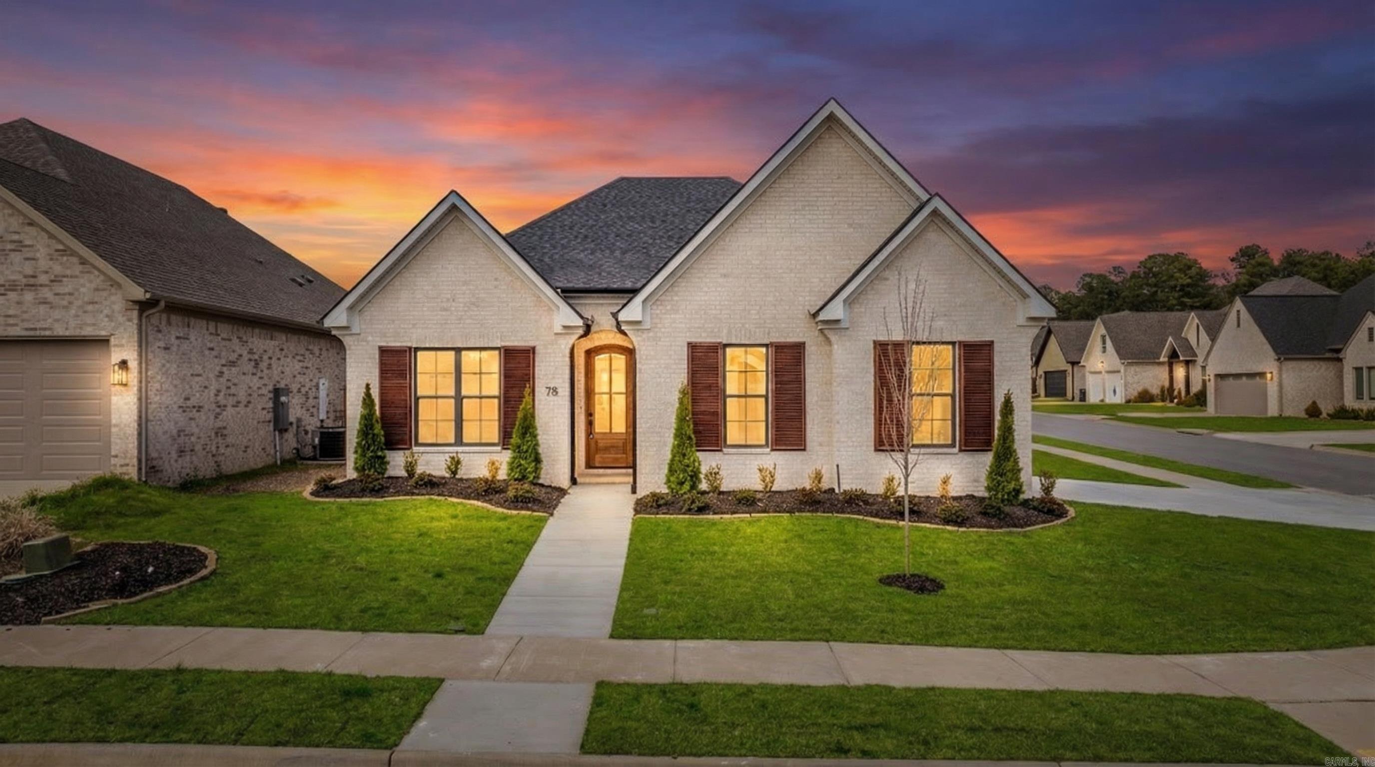 New construction by Graham Smith Construction on a corner lot in Copper Run. This 3 bedroom 2 bath home features a side load garage, open layout, and designer finishes throughout. The kitchen offers white quartz countertops, a large island, and LG appliances. The split floor plan includes a private primary suite with soaking tub, walk in shower, double vanity, and a spacious closet connected to laundry. Two additional bedrooms and a full bath sit on the opposite side of the home. LVP flooring throughout. Enjoy the covered back patio and large backyard with plenty of room to relax or entertain. Additional features include a laundry room with sink, sprinkler system, and energy efficient systems. Located in one of West Little Rock’s most desirable neighborhoods just minutes to parks, schools, shopping, and dining.