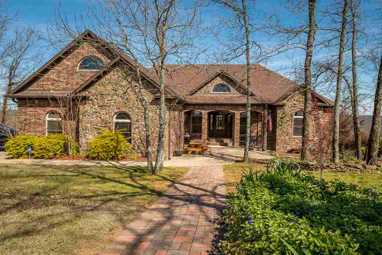 Over 5 acres with fantastic views to both north and south.  This home offers just about everything in addition to the breathtaking views. Dream kitchen with 6 burner plus grill Jenn-air range, double oven 6'x7' quartz breakfast bar, wood ceilings, surround sound system, 3/4 Oak wood floors, 2x6 exterior walls with cellulose insulation, 2 wood burning fireplace, ice maker, Anderson wood sash windows, solid wood doors (3'wide), barn, outdoor kitchen, green house, zone HVAC and Marathon water heaters. hot tub.