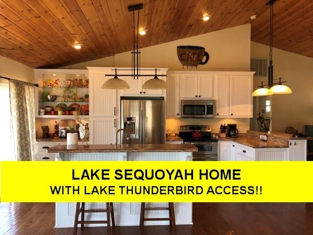 COME CHILL at the Lily Pad Landing on beautiful Lake Sequoyah! 4 bedroom 2 bath, private boat dock! SUPER LOCATION- nearly level back lot- fenced area in yard. Close to Town Center & Lakeview Dinette! FRESH-sparkling clean kitchen and 2 great bathrooms-Washer & dryer, Streaming TV & FREE WIFI! Charming back deck viewing out to the LAKE, perfect spot to sip your morning coffee, read a book, or just WATCH THE BOATS GO BY!  Lake Sequoyah flows into Lake Thunderbird so take your boat or kayak and cruise thru the canal into Lake Thunderbird (ski lake).  3 queen beds, 1 double bed (2 up-2 down).  2 updated baths -handicap stools.  Vaulted living room with GREAT LAKE VIEWS...Home is well stocked. Gas BBQ on the deck. BIG SCREEN TV!  Central heat & air plus gas log fireplace for the fall or winter chilly nights. No loud parties or unruly guests or you will be asked to leave with no refund. Reserve early as this home  books fast!  Folks must clean up after their furry friends. NO SMOKING PLEASE!  $2500  per monthly rate  Dec - March includes utilities, WiFi, trash, etc.or $250/night IF between Oct-March call about winter rates. All w/cleaning fee + tax. Sqft, measurements are per ARCoData
