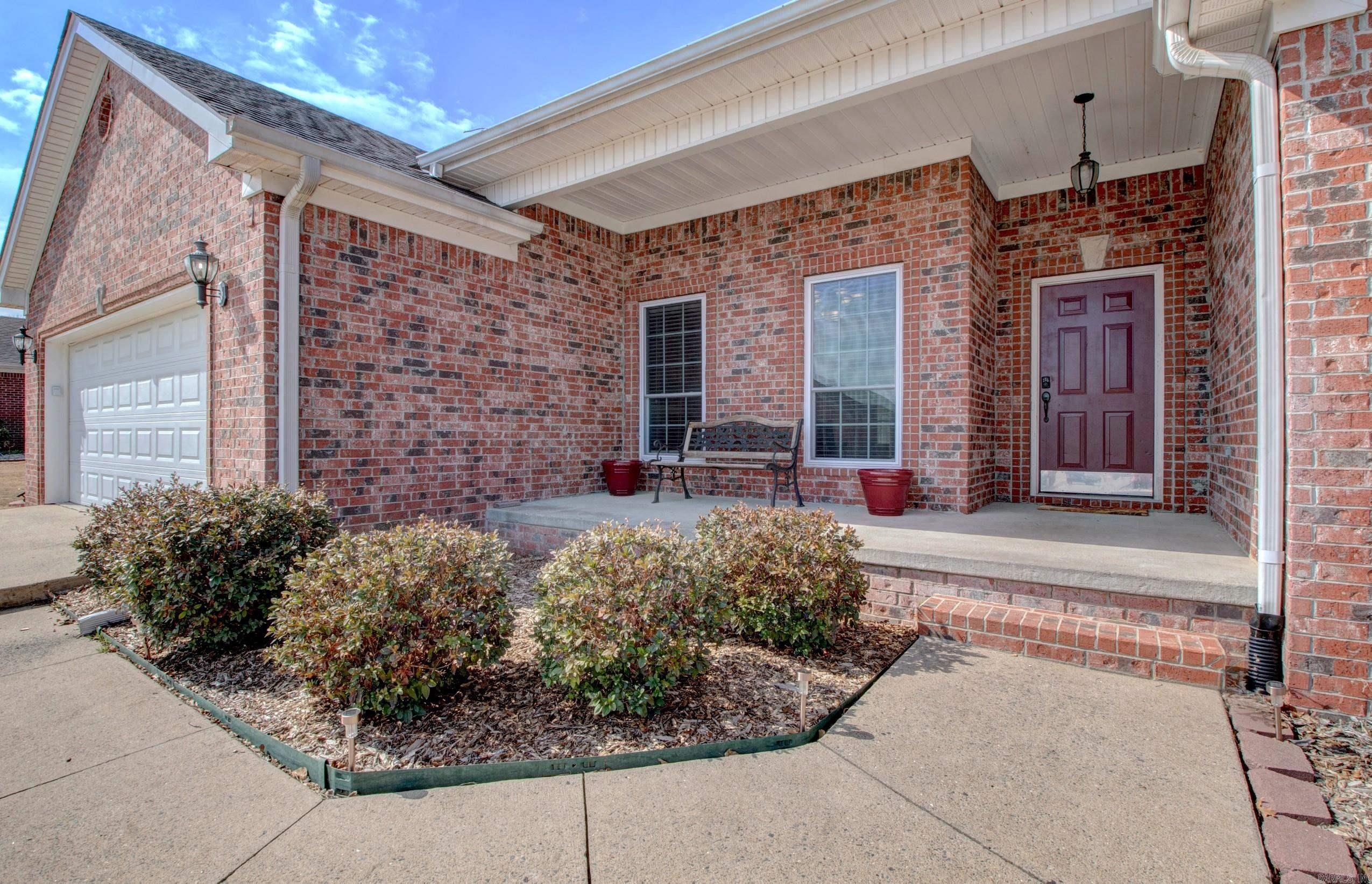 STOP SCROLLING — THIS IS THE ONE!  Fresh NEW paint, NEW carpet, NEW windows, and a NEW kitchen sink make this stunning 4BR/3BA home in Austin Lakes on the Bay PH II truly move-in ready.  Step inside to an open split floor plan with 2,286 sq ft of well-designed living space. The main areas feature sleek ceramic tile flooring for a modern, low-maintenance lifestyle, while the bedrooms offer plush carpet for added comfort. A cozy fireplace anchors the main living area, and the Jack-and-Jill bathroom layout adds convenience for families or guests. Outside, enjoy an expanded outdoor living area perfect for entertaining. The brick exterior, 2-year-old roof, NEW windows, and an oversized garage with extra storage provide long-lasting quality and functionality.  All of this is located in a quiet Sherwood subdivision with fast interstate access and close proximity to shopping, dining, and more.  Don’t miss this one — homes like this don’t last.