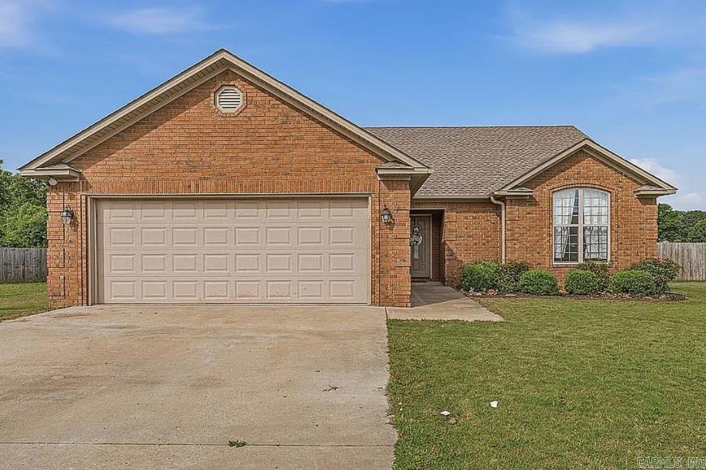 Conveniently located near NEA Baptist Hospital, shopping, and dining, this wonderful brick home offers comfort, style and convenience. Built in 2014, this 3-bedroom, 2-bath home features high ceilings and an open, inviting floor plan. The spacious living area includes a cozy gas log fireplace, while stained concrete floors throughout provide durability and easy maintenance.  The kitchen is equipped with stainless appliances, and the home also includes a 2-car garage for added storage and convenience. Step outside to enjoy the covered back porch overlooking the privacy fenced backyard-perfect for relaxing or entertaining.