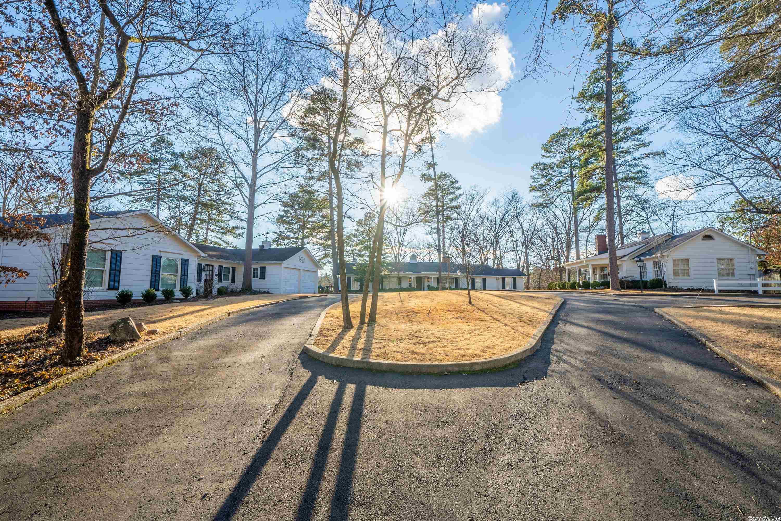 This family retreat is one of a kind. Three homes on Lake Hamilton! They are all professionally decorated and landscaped. The main house is 2 BR, 3 full baths, a pro kitchen, and a whole house generator. One of the guest cottages has 2 BR and 2 full baths, fireplace, and a full kitchen. The third cottage has 4 BR and 3 full baths. It also features 2 Large gathering areas. Outside you will love the ipe wood decks and the flagstone patios. There is a built in hot tub, firepit, and a boat dock with a lift.