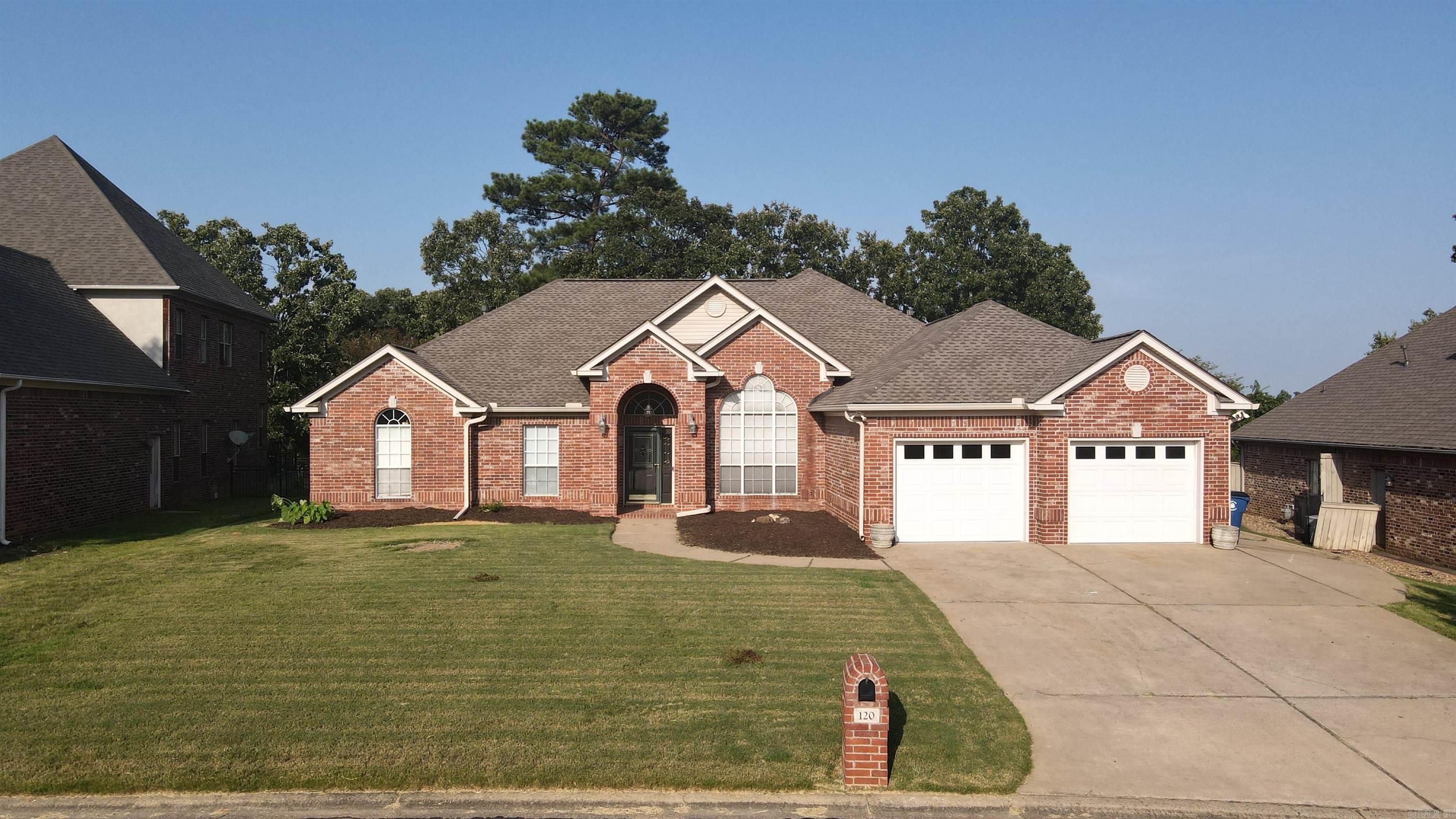 Enjoy golf course living in The Country Club of Maumelle. This beautifully maintained 4 bedroom, 2.5 bathroom home with 2597 sq. ft., is perfectly situated on Hole #10. The spacious primary suite features a cozy fireplace, space enough for a sitting area, and 2 walk in closets with built in dressers. The well designed kitchen offers 2 ovens, while the eat in kitchen area includes a convenient coffee bar plus a separate formal dining room for entertaining. Beautiful flooring flows throughout, and all bedrooms are generously sized. Step outside to a large backyard with plenty of space for gatherings and relaxing while enjoying the golf course setting. The oversized 2 car garage includes an additional roll-up door for golf cart storage. This move in ready home offers comfort, space, and ideal location for entertaining both inside and out. Schedule your showing today!!
