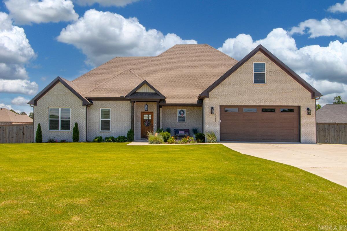 Welcome home to this newly built, custom masterpiece sitting on approximately one acre in the highly desirable Hope Valley Estates neighborhood of East End. Perfectly designed for modern living, the main level features four spacious bedrooms and two-and-a-half baths, complemented by a versatile upstairs bonus room ready to serve as a fifth bedroom or media retreat. The interior shines with premium custom cabinetry and sleek quartz countertops, while the rare addition of natural gas powers a gourmet stovetop and cozy fireplaces—both inside and out. Step through to the fully fenced backyard to find an entertainer's patio perfect for family gatherings, or take your golf cart for a spin through a vibrant community that boasts its own pickleball court, children park, and dedicated dog park. This pristine, move-in ready property is an exceptional opportunity you truly do not want to miss!