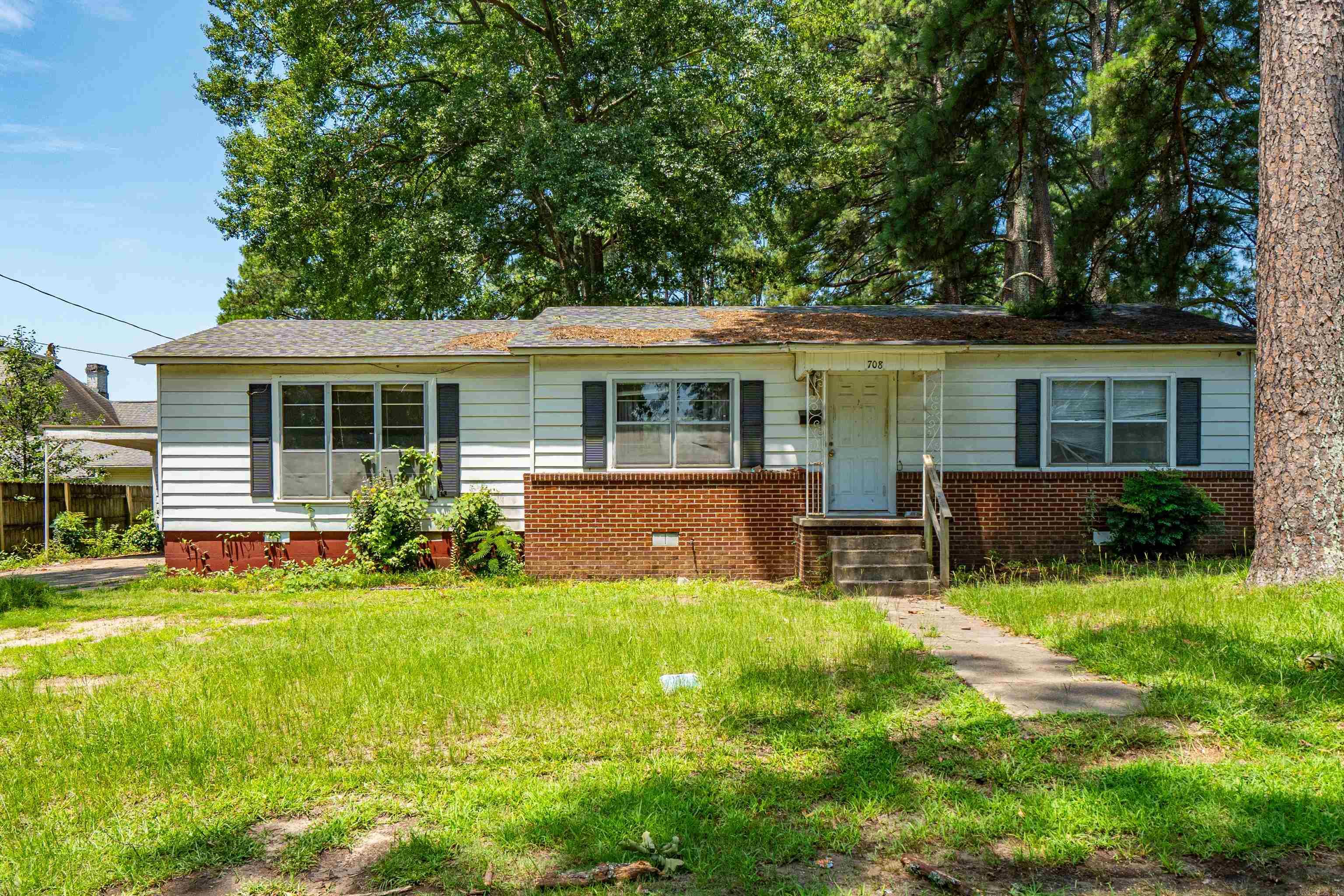 Opportunity awaits in this spacious 3-bedroom, 2-bath home offering approximately 1,696 square feet of living space! Situated on a city lot, this property features a low-maintenance yard that’s perfect for those looking for easy upkeep. The bright and inviting living room is filled with natural light thanks to its large windows, creating a warm and welcoming atmosphere. A covered two-car carport and attached storage room provide plenty of convenience and extra space. Ready for your personal touches and updates, this home offers a wonderful opportunity to make it your own while enjoying its generous square footage and great layout.
