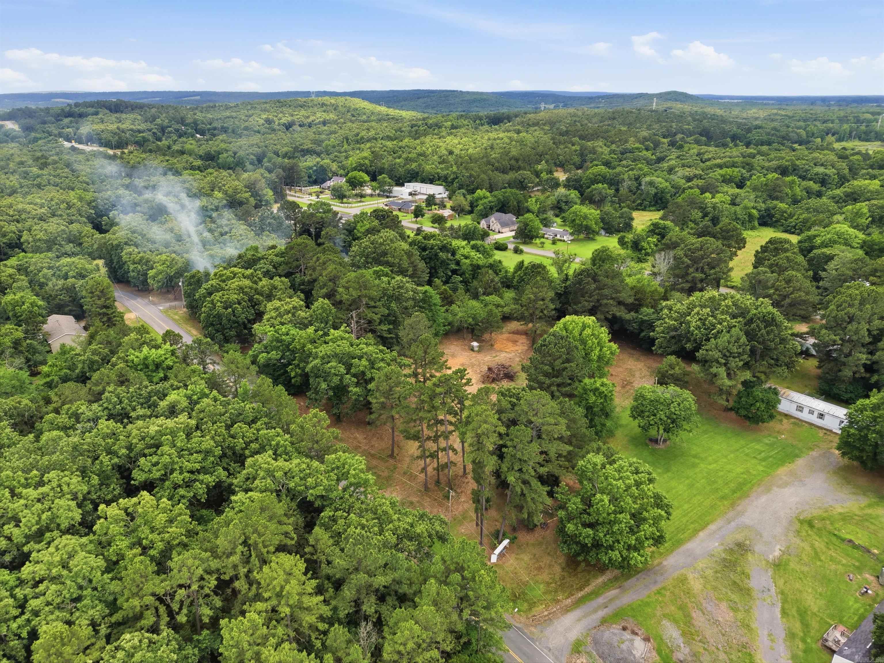 1.5 Acres with 198 feet of road frontage and 330 feet long! Storm shelter, well house, Septic that had 2 mobiles mobiles on it at one time, electrical on the property! Lot has been cleared!