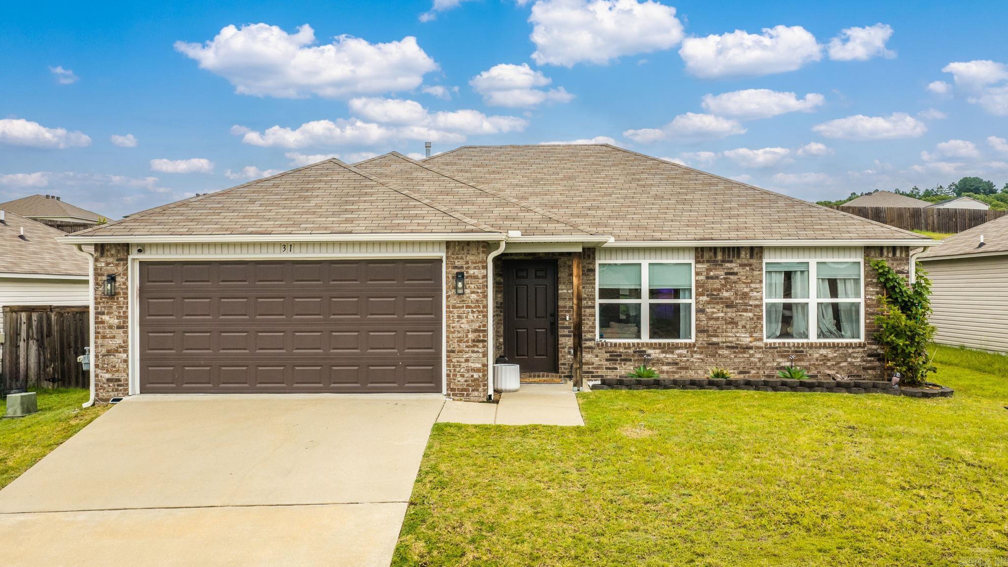 Welcome to 31 Summer Wind Road in Conway! Built in 2020, this beautifully maintained 3-bedroom, 2-bath home offers the perfect blend of modern updates and peaceful country living. Inside, you'll find new flooring, fresh paint, new kitchen backsplash, updated light fixtures, and new hardware throughout, creating a move-in ready space that feels fresh and inviting. Additional improvements and meticulous care make this home truly stand out.  Enjoy the convenience of a spacious 2-car garage and a fully fenced backyard, perfect for pets, play, or relaxing evenings outdoors. You'll love the space the laundry room has along with a kitchen pantry for all the ultimate snack storage!   Located just minutes from all the shopping, dining, schools, and amenities Conway has to offer, you'll love the quiet setting and country feel without sacrificing convenience. If you're looking for a home in exceptional condition with modern style and a great location, this is one you won't want to miss! Be sure to watch the video walkthrough. This home qualifies for the USDA-RD loan (no down payment!)