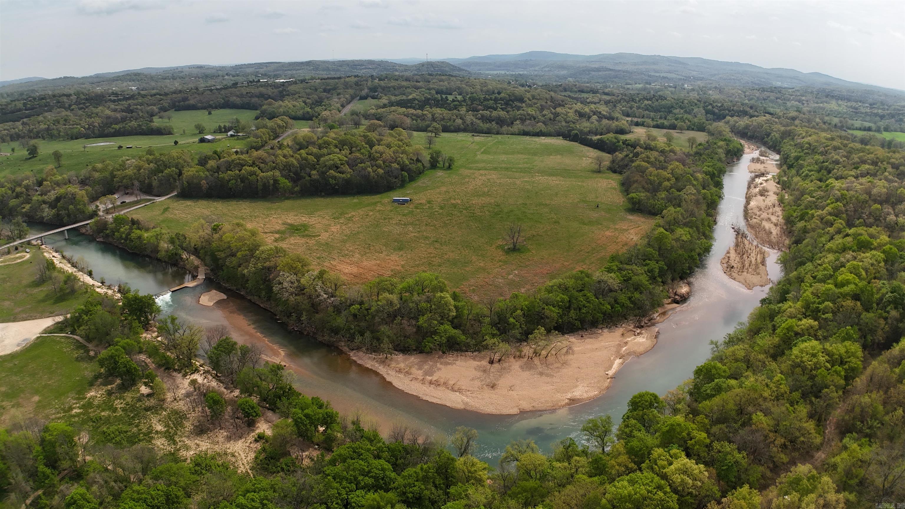 Just a stone’s throw away from the city limits, nestled along the banks of the serene Crooked Creek, this breathtaking 140.2-acre parcel of land is your opportunity to own a slice of paradise. The property offers endless possibilities for those dreaming of homestead, agriculture, or a recreational retreat.  Benefit from 2 new wells, perimeter fence, cross fence, and livestock corral for your farming operation or catch a few minnows in the year-round creek running through the property and do a little fishing.  The property also holds potential for developing a charming RV campground.  The engineer work is already completed.  Enjoy the recreational opportunities of camping, fishing and floating on Crooked Creek.