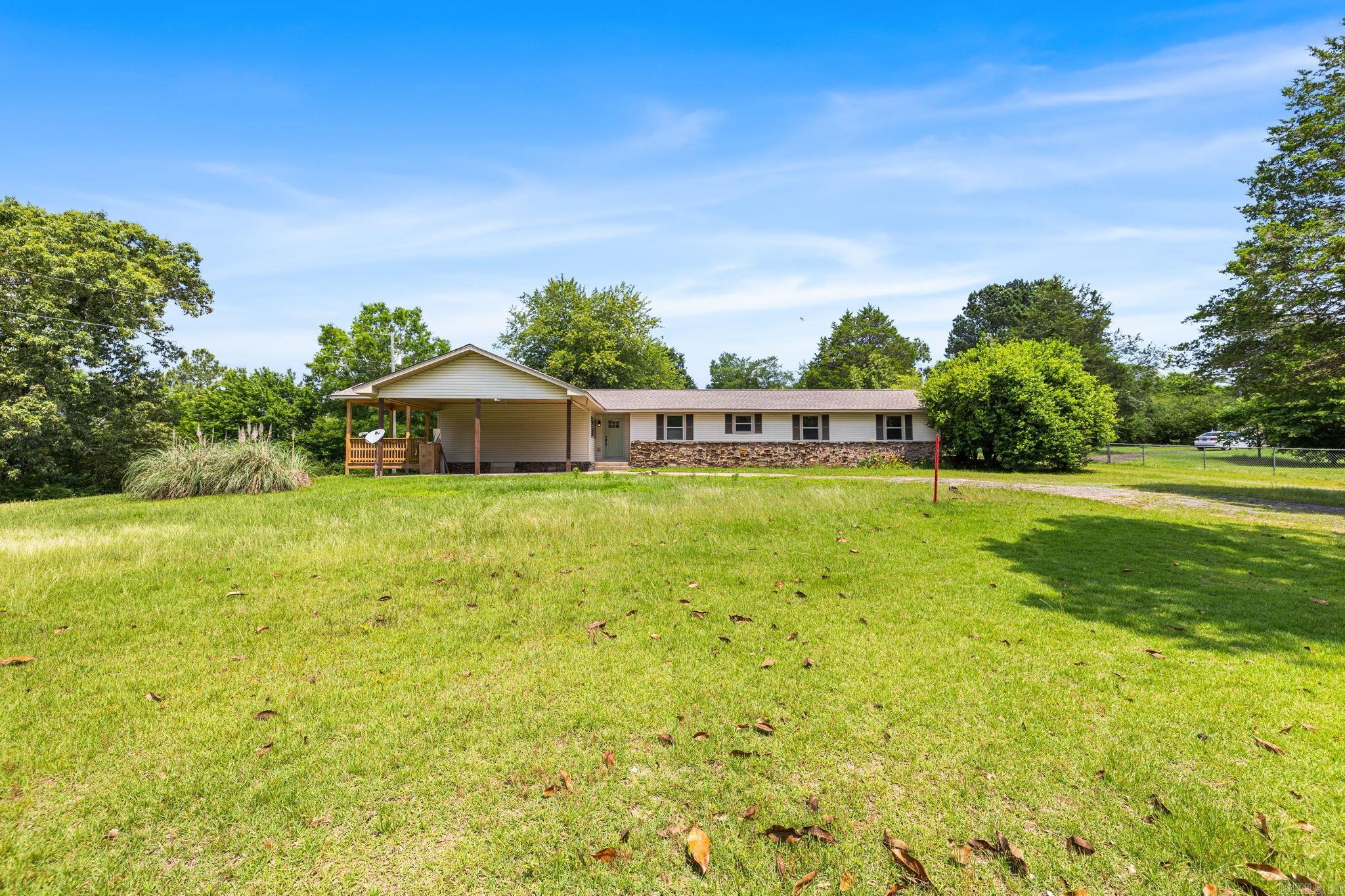Country Living with Brand NEW Modern Amenities! This 4 Bed, 3 Bath Ranch style home is located on 2 lush acres within minutes from the heart of town! The interior of this home has been COMPLETELY RENOVATED! New Kitchen offers brand new double ovens, farm sink, refrigerator, granite countertops and LOADS of cabinets, including a built in buffet! The open floor plan and spacious Great Room allows plenty of space for gathering friends and family! Large Bedrooms and roomy Bathrooms are finished off with new lighting and fixtures. The Laundry Room includes space to add some extra storage. Brand new, covered deck is the perfect spot for your morning coffee! Plus, a NEW roof and NEW HVAC! What's not to love? Call today to schedule a private showing!