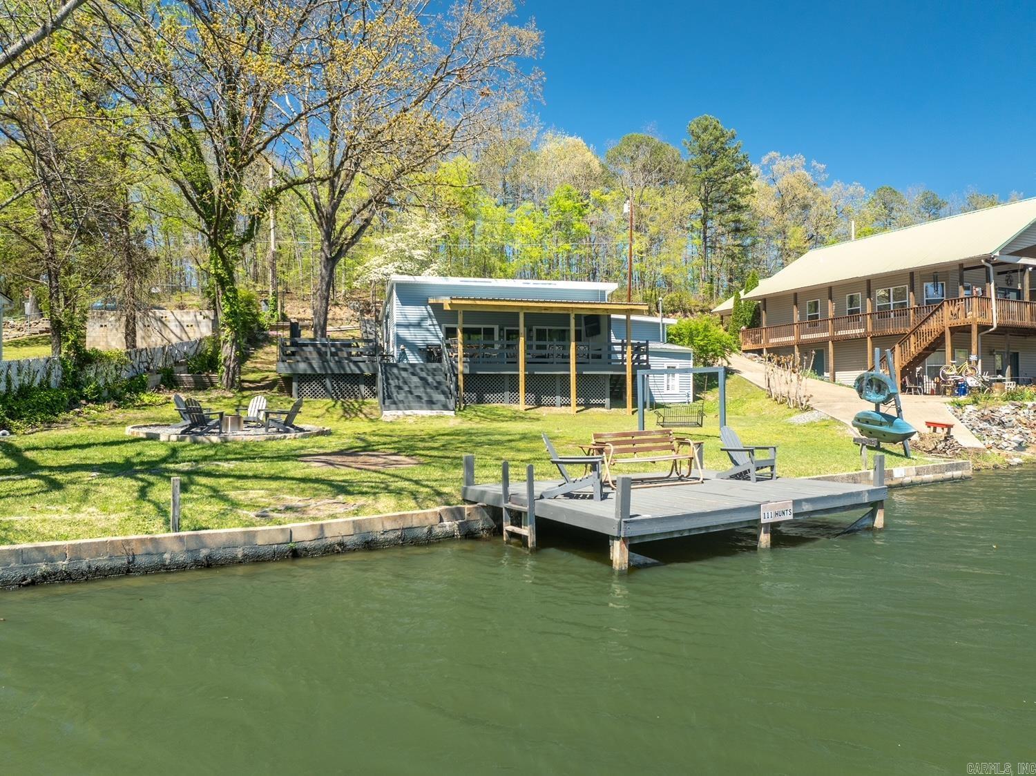 Lakefront Oasis in Hot Springs, AR! This is an excellent short term rental investment property, with a transferable active STR license from the city of Hot Springs.  - LAKE FRONT - 5 MIN FROM OAKLAWN - PROVEN REVENUE RESULTS