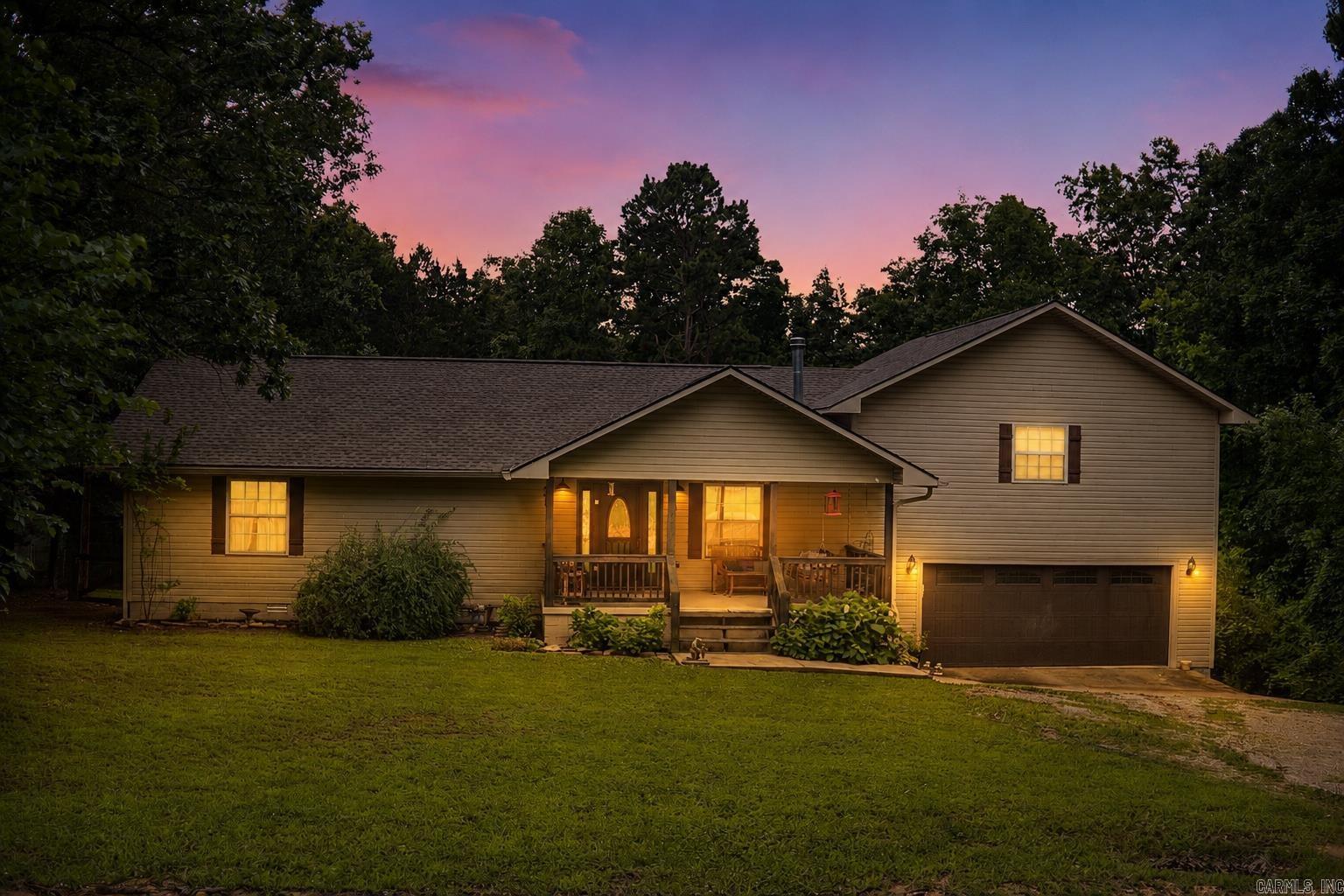 Now offered under $300k! Spacious 3 bed, 3 bath home with 2,200+ sqft tucked into the peaceful Ozark hills just minutes from downtown Mountain View. This home sits on approximately 0.64 acres and offers the perfect blend of privacy, comfort, and small-town charm.  Inside, the home features 2,266 square feet of living space with warm wood flooring, a cozy wood-burning stove, and a layout designed for both everyday living and entertaining. The spacious vaulted master suite feels like its own private retreat, complete with a balcony perfect for morning coffee, a relaxing soaker tub, tiled walk-in shower, and a generous walk-in closet.    On the lower level, a bright sunroom filled with natural light offers endless possibilities — whether you need a home office, or a hobby room. Step outside to enjoy the large deck overlooking the fenced backyard and surrounding Ozark scenery, creating the ideal space for grilling, relaxing, or letting pets roam.    Major updates bring peace of mind, including a roof replaced about two years ago, two water heaters, and two HVAC units with one recently replaced.