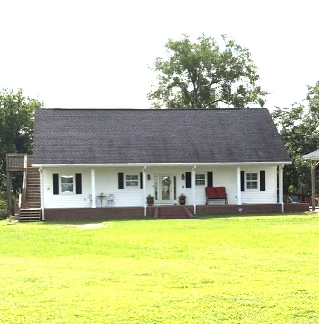 Rare find bordering the Ouachita River!  This beautiful one of a kind 3 bedroom, 2 bath home featuring vaulted ceiling and gas log fireplace in the family room with picturesque views.  The expansive deck and inground pool with new liner overlooking breathtaking views of the Ouachita River offer incredible outdoor entertaining opportunities. Nestled on 7 acres MOL, the property also offers a pool house, red wood greenhouse, stock pond, horse barn with tack room, shop, fruit trees, and firepit area. Whether you are looking for a home or vacation getaway home, this is a must see property. Located in the highly sought-after Ouachita School District.