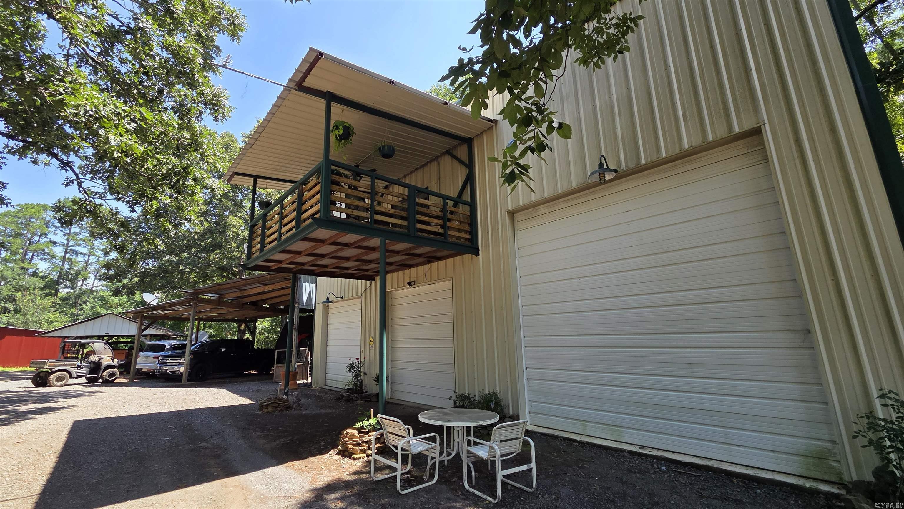 **Income-Producing RV Park & Updated Home with Stocked Catfish Pond – Prime Investment Opportunity!** This turnkey RV park features three 30/50 amp rental slots generating $1,500 per month at $500 each. Electrical service is available for two additional slots, with new water lines installed throughout. Enjoy a brand-new laundry room with shower and property-wide WiFi for guest convenience. Home & camp sites on City water while the well supports the laundry operations alone. The home offers peace of mind with a 2017 roof replacement and 2025 updates including new stainless steel appliances, water heater, and flooring. A recently installed 4-ton AC unit delivers reliable cooling while it also has a backup space heater, and the downstairs is fully heated and cooled as well. Multiple garage doors provide ample storage: two 8-ft and one 10-ft wide garage doors.  Complete the package with a fully stocked catfish pond for fishing and recreation. This property blends steady rental income with comfortable living space in a serene setting. Square footage TBD. Contact your local realtor today for more information and to arrange a showing!