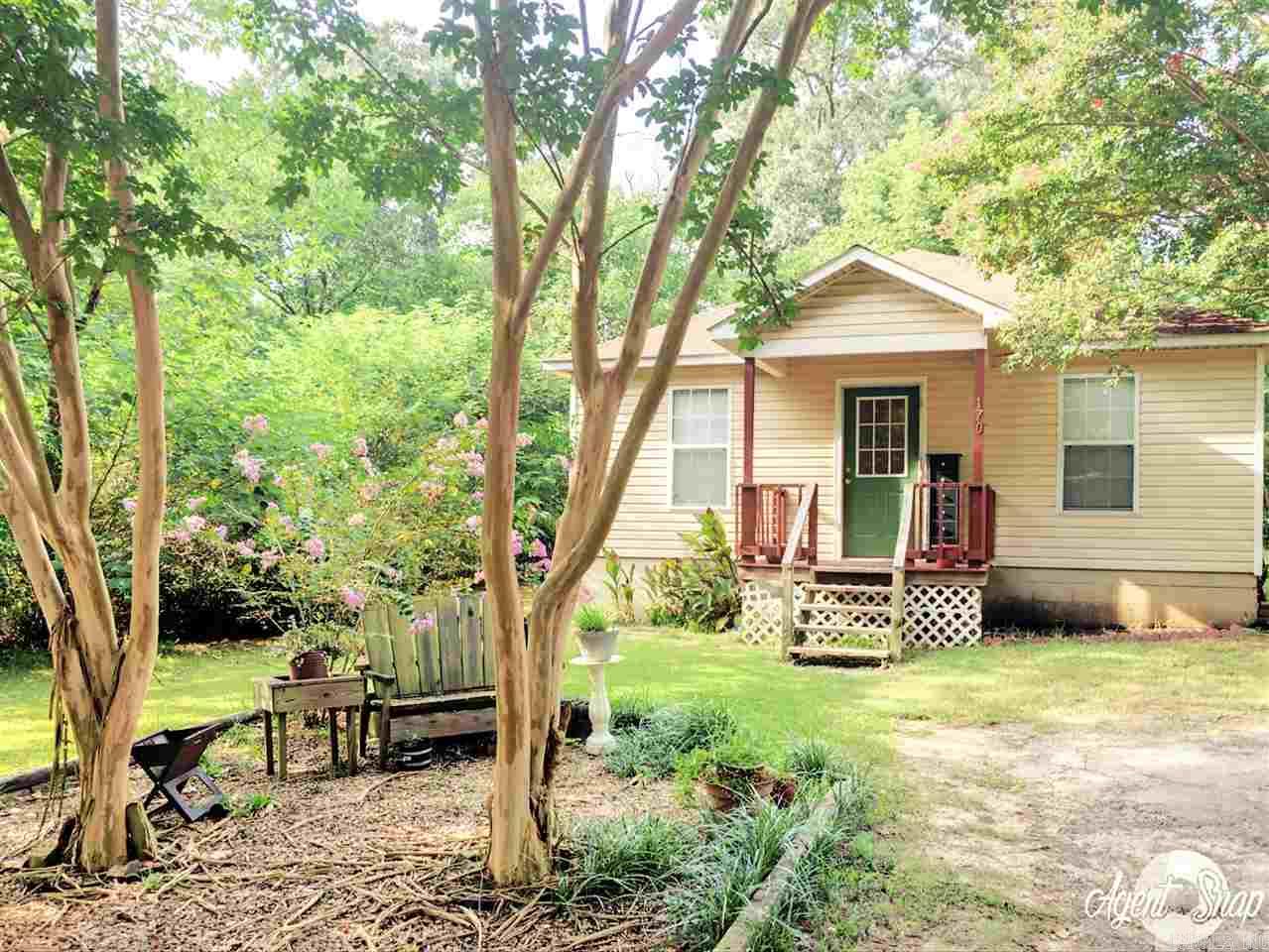 This adorable cottage built in 2000 is on a quiet horseshoe street with only a handful of houses. Just step around the corner to Lake Conway. Privately owned lot at the end of the street for neighborhood only access to the Lake. Home has fresh new paint, HWH 2013, new laminate flooring & 1yr home warranty. Have that affordable lake house you always wanted yet not too far from the city! This one won’t last! Call for a private showing!