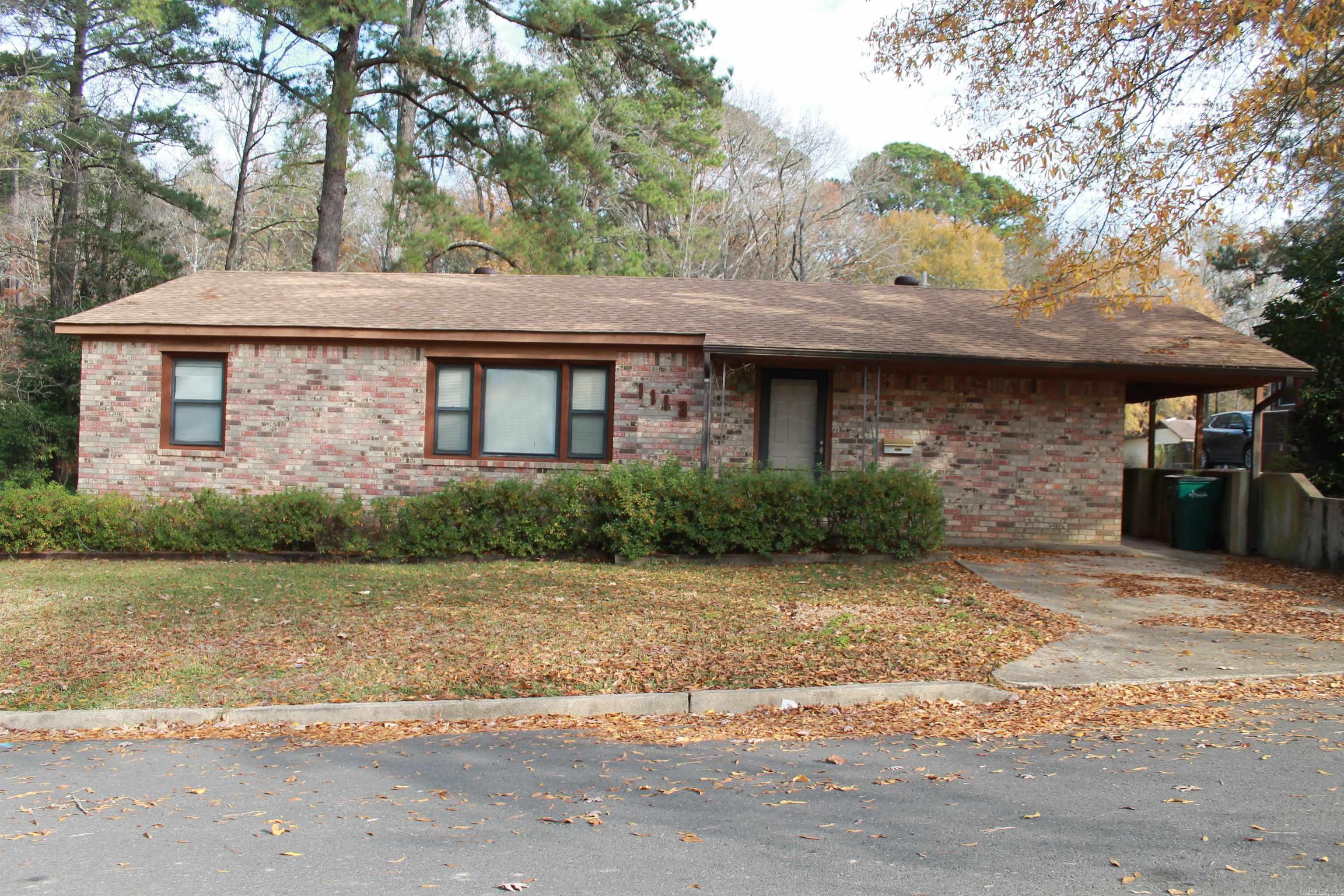 Brick and cedar house located on corner lot at dead end with access from the front and back of house. Large double carport in rear that faces Bradford Street.