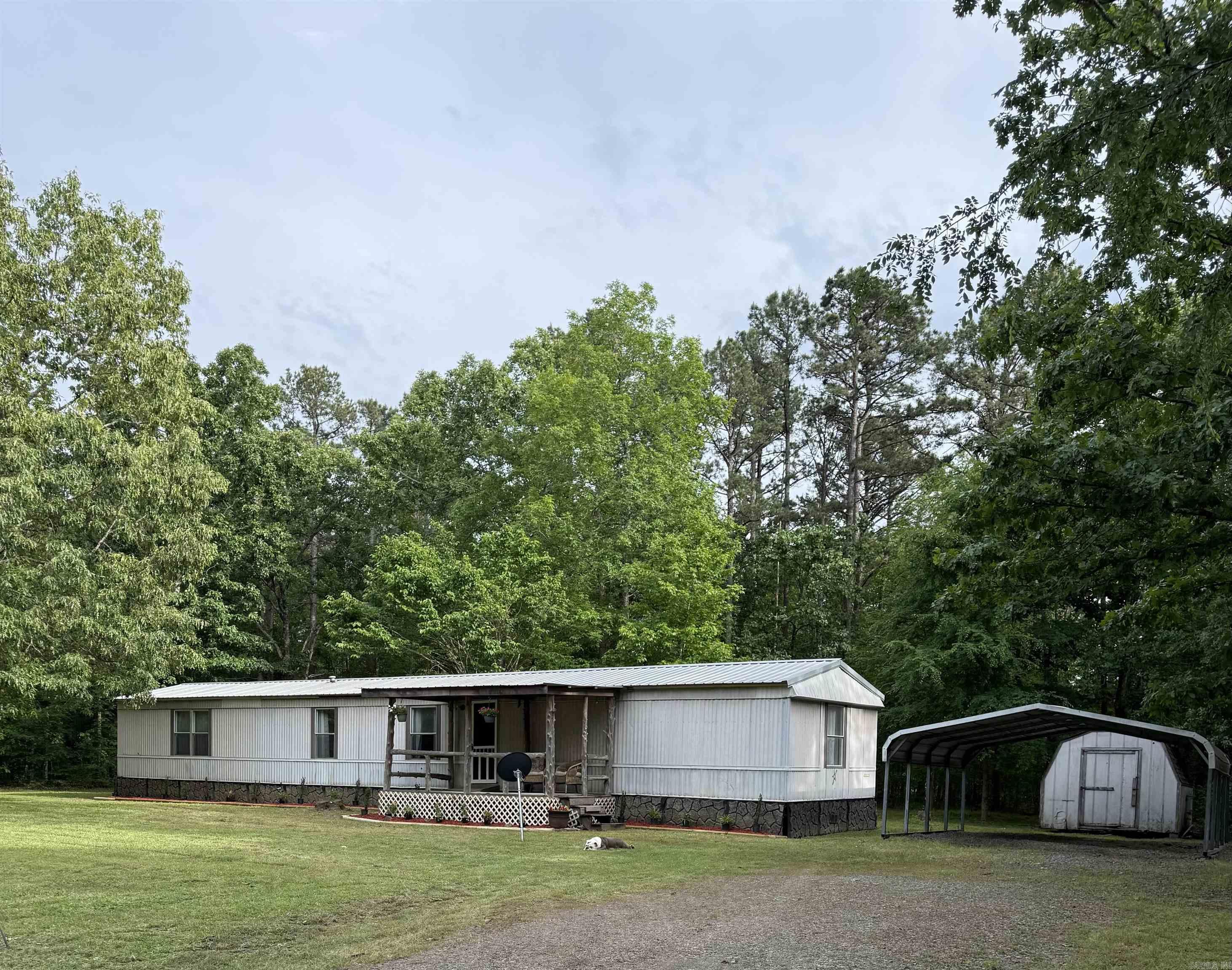 Newly remodeled mobile home on a little more than a half acre lot. Inside features new wood trim and solid wood doors and cabinets. First picture shows new landscaping added 04/30. New kitchen appliances, all new vinyl plank flooring. Two-car carport and storage building stay. Washer and dryer stay. Close to Sugarloaf Marina. At the end of a dead-end road with lots of privacy and very little traffic. This would make a great full-time home, weekend home, or vacation rental. Seller making improvements to qualify it for traditional financing. Make your appointment today to view in person.