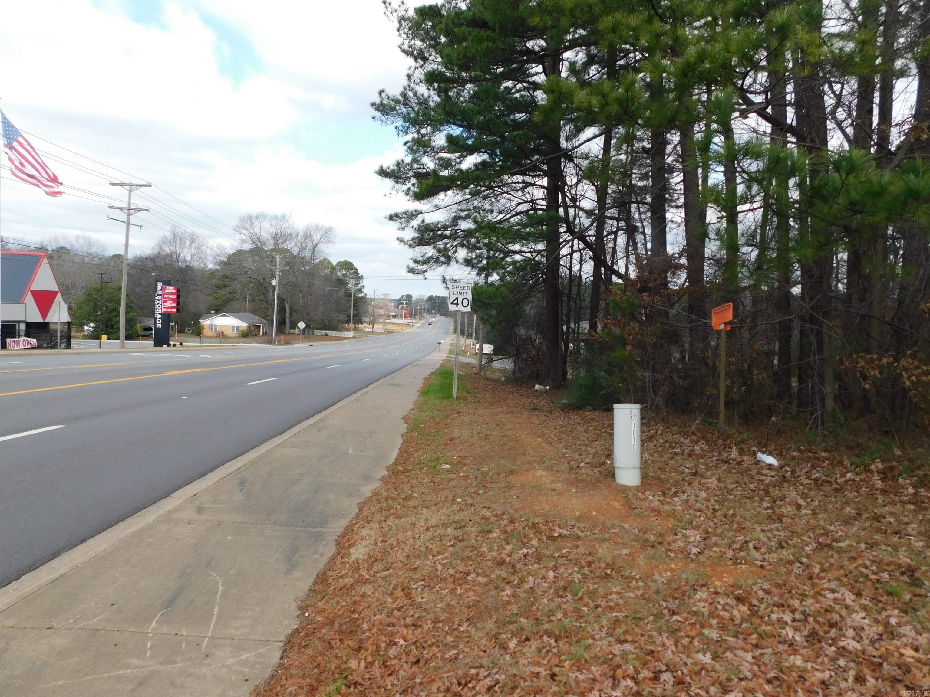 Owner says bring all offers!  Great opportunity for development!!! This .93 acres +/- is located on one of the most highly visible and traveled streets in Bryant, one of Arkansas' fastest growing cities.  It is near many other national chains and would be great for many different uses.  Also very near I-30.  Partially wooded, utilities at the street!