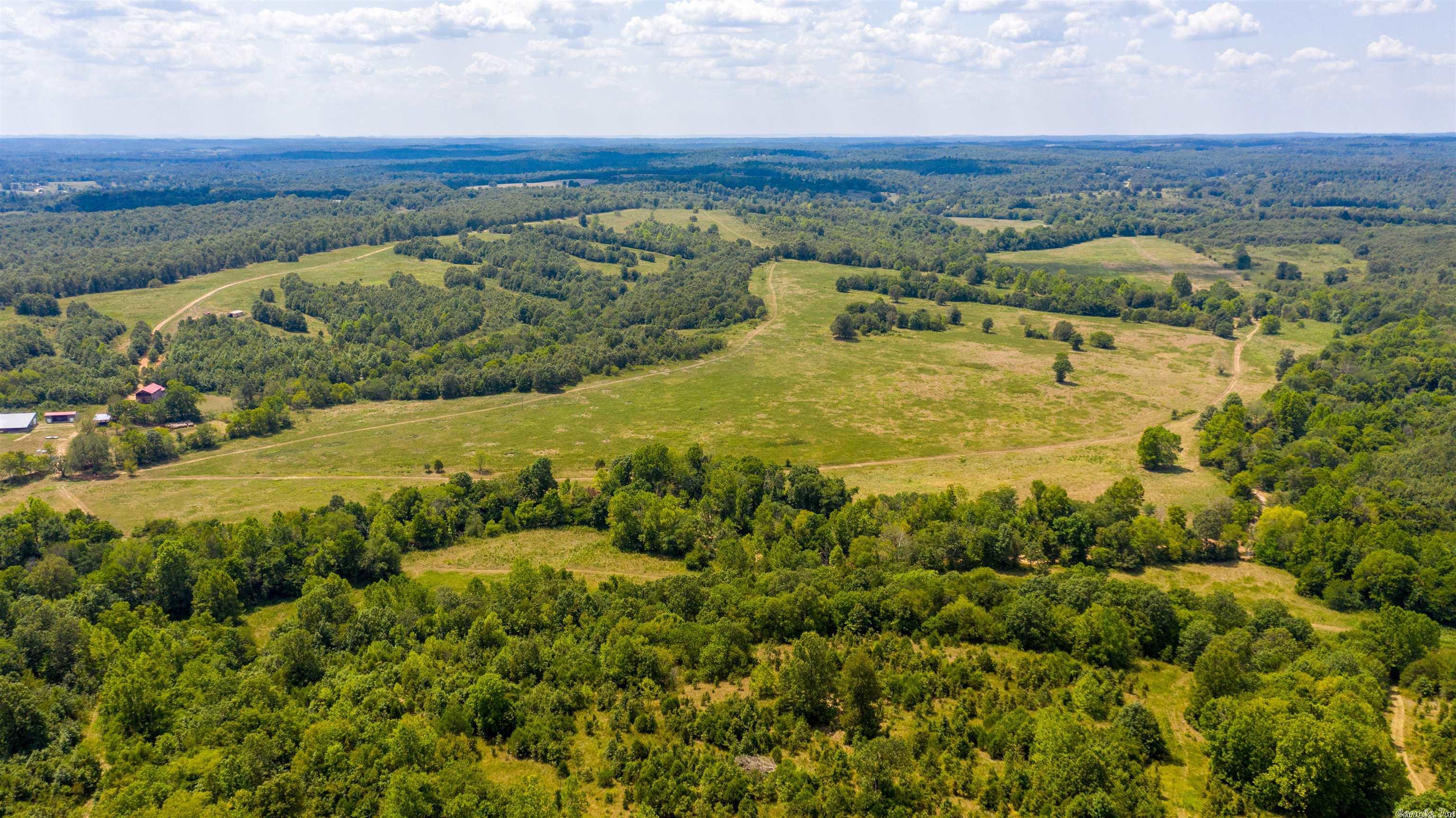 This is an incredible farm, hunting ground, home, barns, working (steel) coral covered, goat pen, all fenced and all with 1 mile of the Strawberry River running through it!  This farm has hay fields, has ran over 350 cow/calf pairs and is excellent hunting!  This is located just west of Glencoe, AR in Fulton County.  This has Country View Road Access along with young road.  You travel through a gate, down a drive where the house is secluded! Still close to Lakes, other Rivers, hospital and stores!