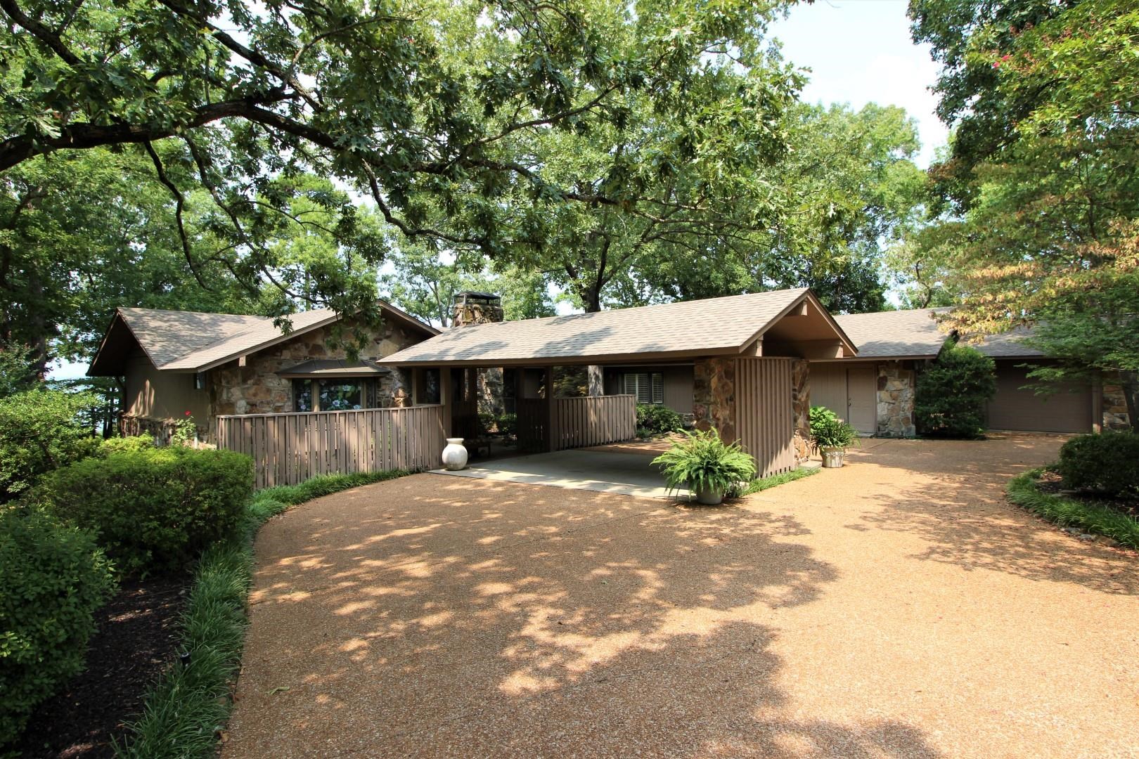 Eden Isle home, on Rock Ledge Road, enjoys spectacular views of Greers Ferry Lake!  Open living area with wall of glass overlooking the lake, 2 master suites, both of which view the lake, 2 living areas, wet bar, 2-car covered parking plus golf cart garage and much more!  A Classic Eden Isle beauty!