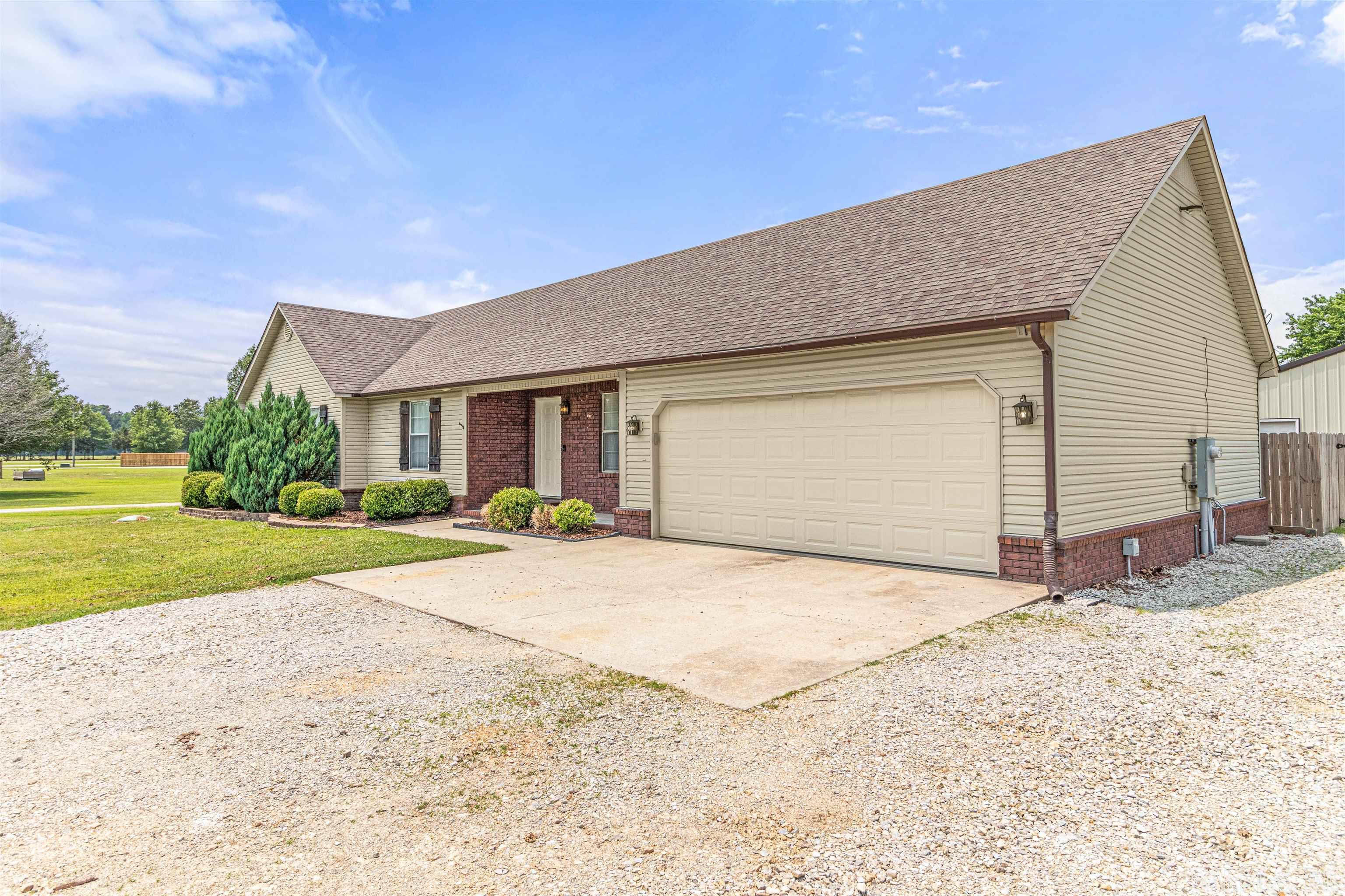 Welcome to 390 Vaughn Dr in Paragould, Arkansas! This stunning 4-bedroom, 2-bathroom home offers an impressive living space of almost 1800 square feet, all situated on a spacious 1-acre lot. Prepare to be captivated by the numerous upgrades and amenities this property has to offer. As you step inside, you'll immediately notice the fresh and inviting atmosphere, courtesy of new carpeting, new vinyl plank flooring, and new paint throughout the home. The attention to detail is evident, creating a modern and stylish interior that is sure to impress.    The main living area features a formal dining space adorned with beautiful wood beams, creating an elegant ambiance for hosting dinner parties or enjoying family meals. The spacious layout allows for comfortable living, accommodating both relaxation and entertainment needs.    This home goes above and beyond, providing additional amenities to enhance your lifestyle. A shop with an extra room, equipped with heating and air conditioning, offers a versatile space that can be used for various purposes. Whether you need a workshop, a home office, or a hobby room, this additional space is sure to meet your needs.