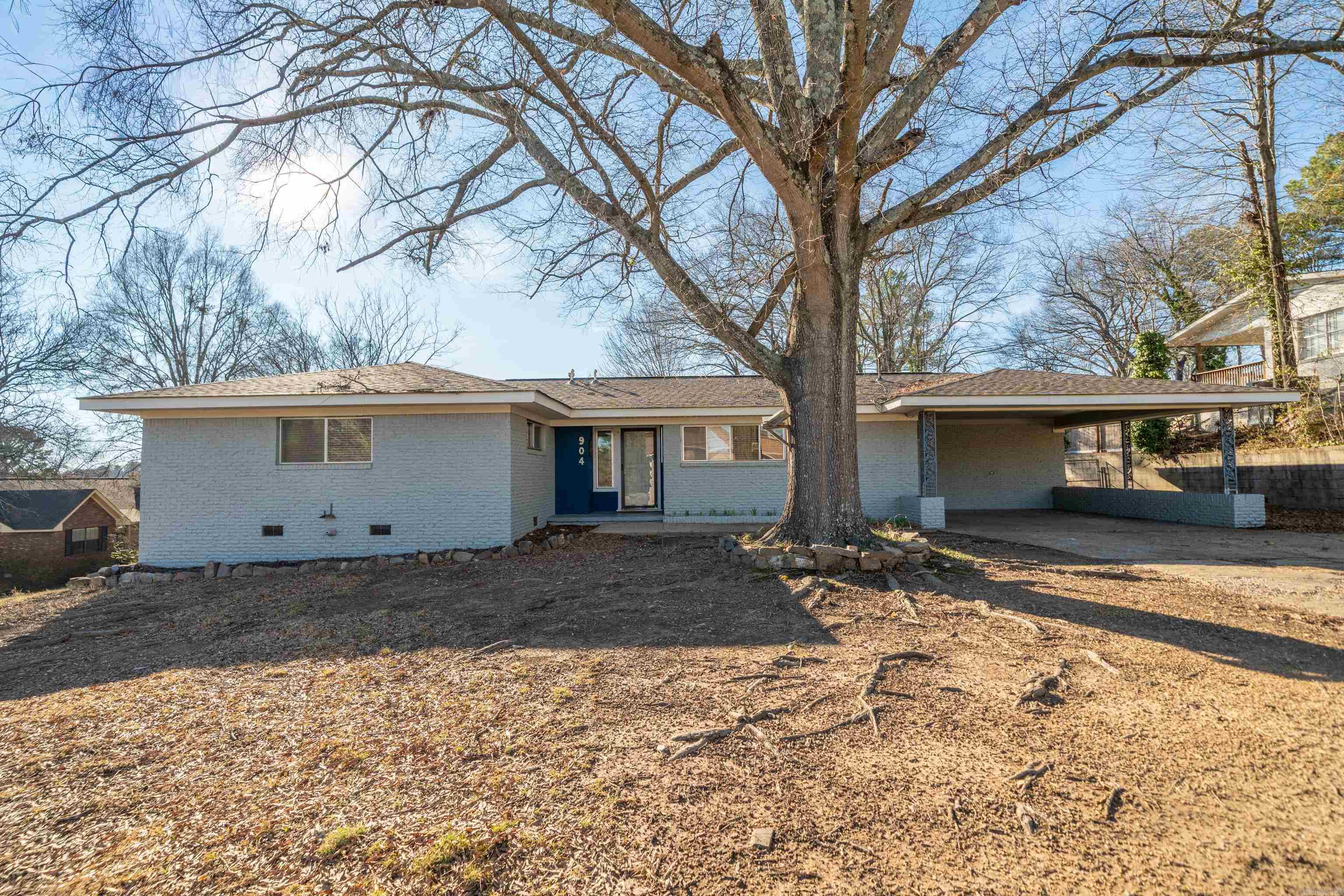 ~Proven Cash-Flowing Rental Just 1 Mile from Oaklawn~ Located in the heart of Hot Springs, this turn-key brick beauty sits on a spacious corner lot beneath the shade of a majestic Willow Oak. This fully furnished, one-level home offers 3 bedrooms & 2 baths, and is currently operating as a successful income-producing short-term rental. Inside, you’ll appreciate original hardwood floors in the living areas and bedrooms, a cozy gas fireplace, and a heated and cooled sunroom that adds valuable year-round living space. The fully fenced backyard provides privacy for guests, pets, or entertaining, while the low-maintenance exterior, newer outdoor HVAC unit, and newer roof offer peace of mind for years to come. Located just one mile from Oaklawn Racing Casino Resort and minutes from all of Hot Springs’ dining, shopping, and entertainment, this property offers exceptional convenience and flexibility. Whether you’re seeking a charming city home, a second home, or a proven investment property with immediate income potential, this one is ready to go.