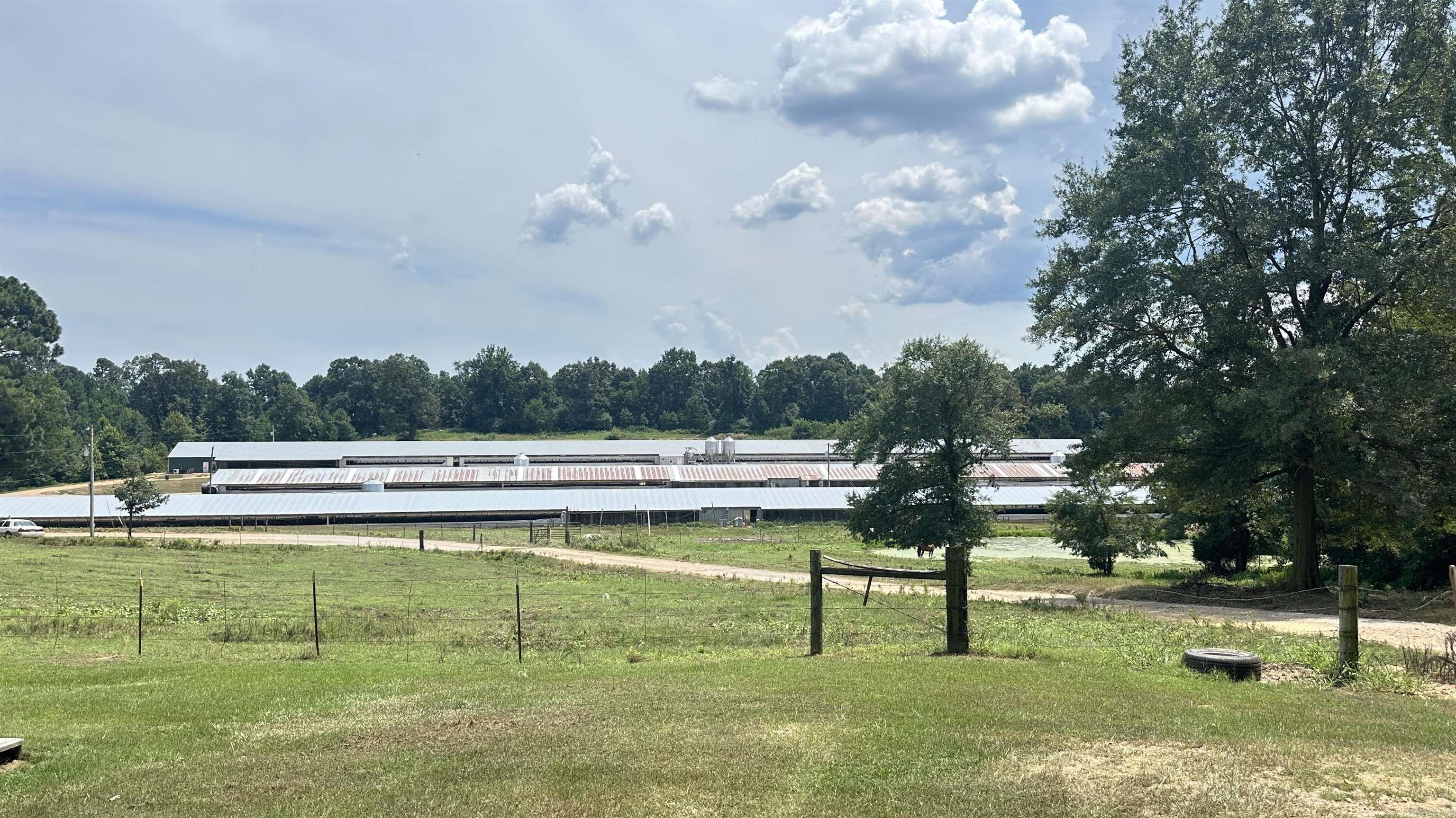 1 dwelling house that was built in 1984 and 1 built in 2000, 3- Breeder houses that are 40x630.