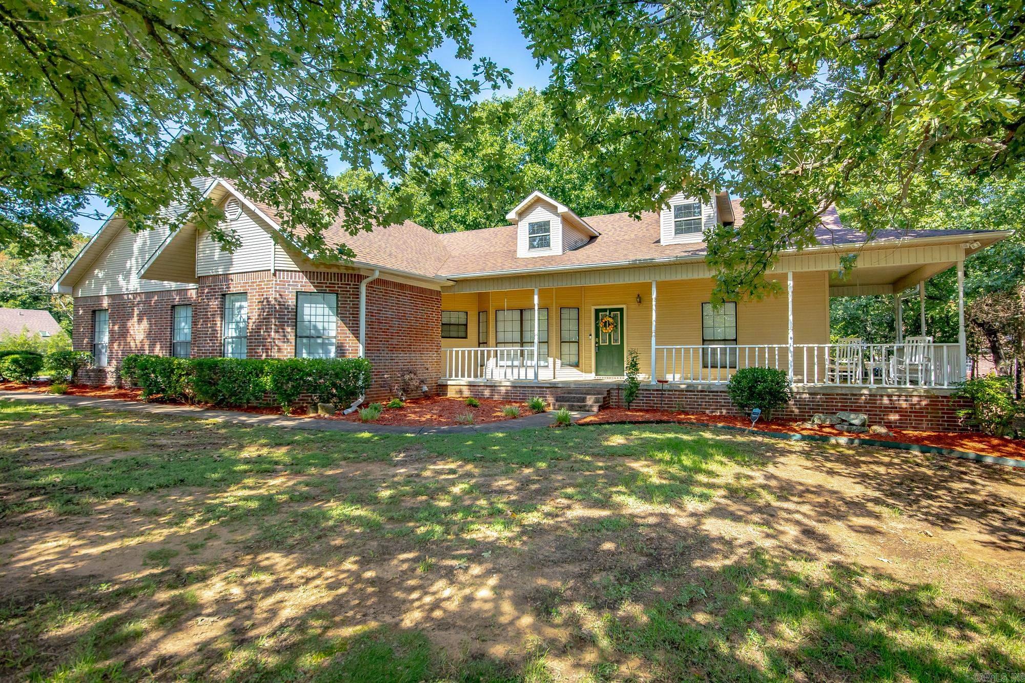 HUGE SHOP! Do I have your attention? Welcome to this beautifully landscaped home in the Wildwood subdivision, complete with charming wrap around front porch. Inside, you'll find an inviting living room featuring rich wood floors and a cozy wood-burning fireplace. The kitchen and dining area flow together seamlessly, offering granite countertops, abundant storage, a center island, & breakfast bar for gathering with family and friends. The split floor plan provides privacy, with a spacious primary suite featuring a large vanity, soaking tub, and walk in closet. Two additional bedrooms, a full bathroom, and a dedicated home office provide plenty of space for work, family, or guests. Outside, enjoy a peaceful backyard with mature trees and a cozy patio. The true highlight of this property is the incredible 30’ x 40’ Shop! Whether you’re a car enthusiast, woodworker, small business owner, or simply need room for toys and equipment, you’ll appreciate the space and versatility it offers. Shop is insulated, heated and cooled! Above the shop is 800 square feet of unfinished space, providing an excellent opportunity for additional living space, gym, studio, or whatever best suits your needs!