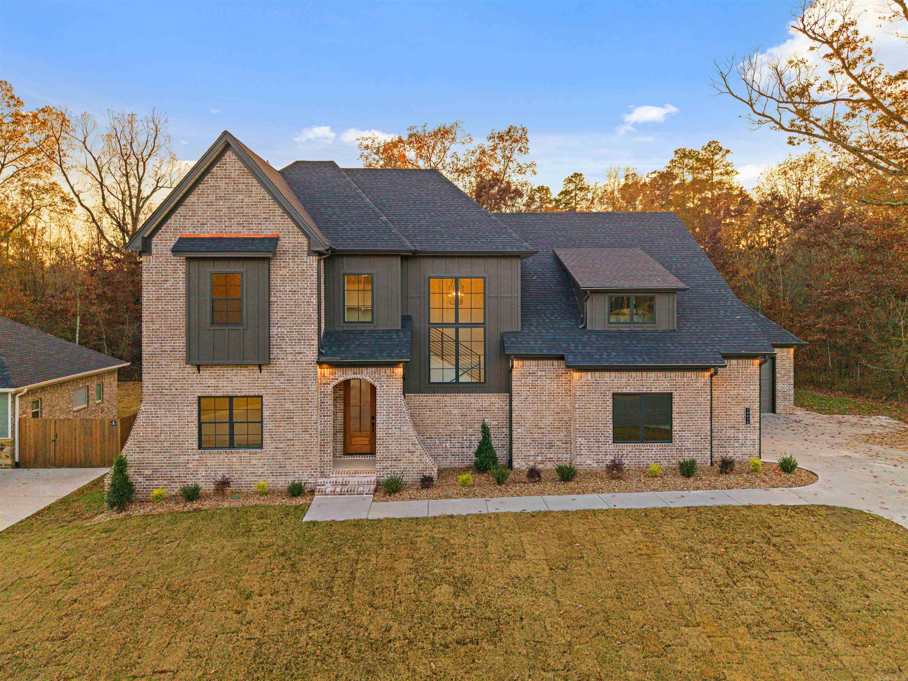 Welcome to 14415 Stonebrook Lane! This home has a green space privacy!   This move in ready home is located in the desirable Stonebrook. Stonebrook was Voted AY Magazines Best Neighborhood in Central Arkansas! Enjoy gated privacy, scenic walking trails, a private lake, and community amenities in one of the most sought-after neighborhoods in Maumelle! This stunning home boasts a spacious 5-bedroom, 3-bathroom layout nestled in the highly sought-after Stonebrook community. With 3,291 square feet of living space, this home sits on a premium lot with greenspace on two sides, offering extra privacy and room to breathe.  The open floor plan is perfect for everyday living and entertaining, featuring a large kitchen, generous living areas, and a seamless flow throughout. Upstairs, you'll find a spacious flex room that can be customized as a game room, media room, or second living area—whatever fits your lifestyle.  Additional highlights include a 3-car garage, thoughtfully designed layout, and access to all the amenities that come with life in the gated Stonebrook neighborhood.  Set up a self guided tour of this home on the Hines Homes website.