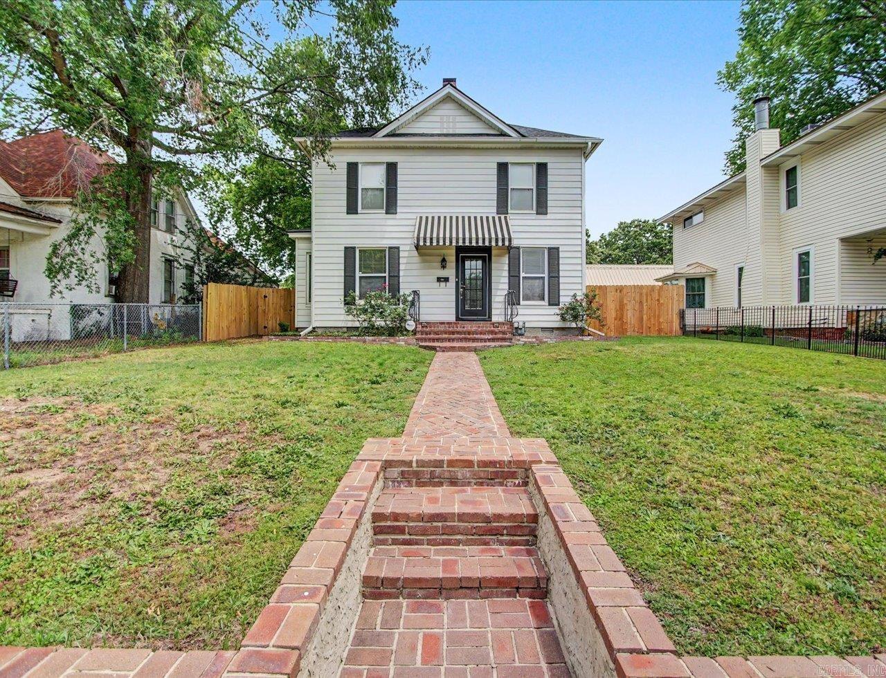 Charming furnished 1890 home with Short Term Rental license directly across from Oaklawn Racing and Casino and one block behind Rocky's Corner. Features 3 bedrooms, 2 baths, resurfaced hardwood floors, updated electric and plumbing, oversized rear parking lot, new roof (2023), new tankless water heater (2026), new washer/dryer (2025), new laundry room flooring, fresh exterior paint on home and detached garage (approx 2023), and new privacy fence (2025). Excellent investment or personal getaway in a prime Hot Springs location. Owner/Agent