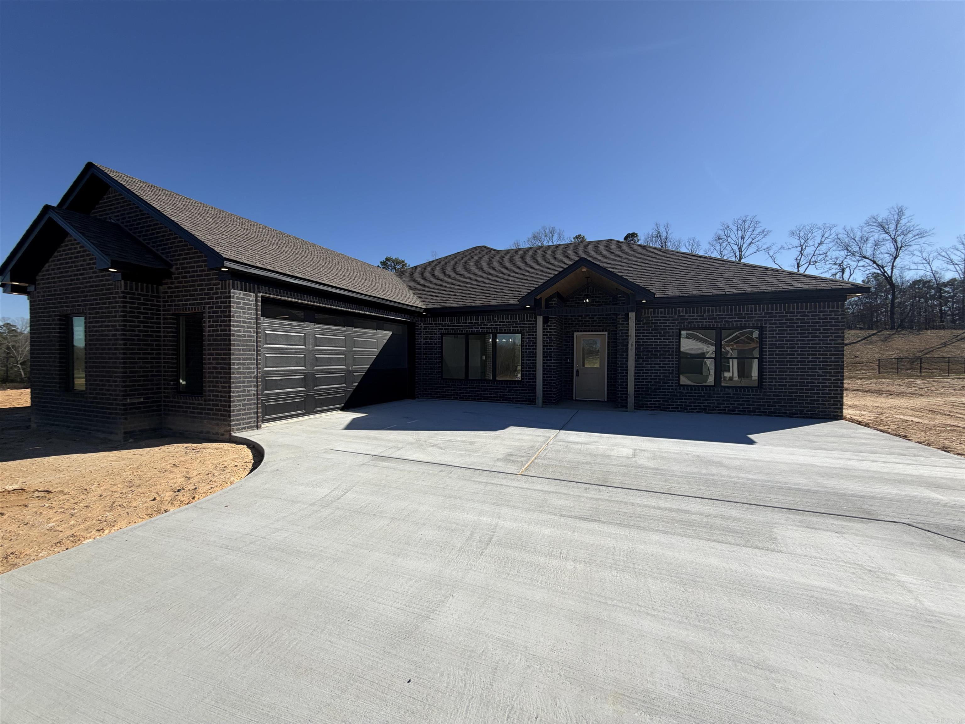 Brand- new construction sitting on 1.12 acres in the new Winchester Estates Subdivision. This 3-bedroom, 2-bathroom home offers an open/split floor plan designed for modern living. The primary suite features a spacious walk-in closet, a luxurious walk-in shower, and a relaxing soaking tub. Nestled against a peaceful wooded backdrop, this property provides both privacy and charm. Bauxite School District!! Hurry and schedule your showing today!!