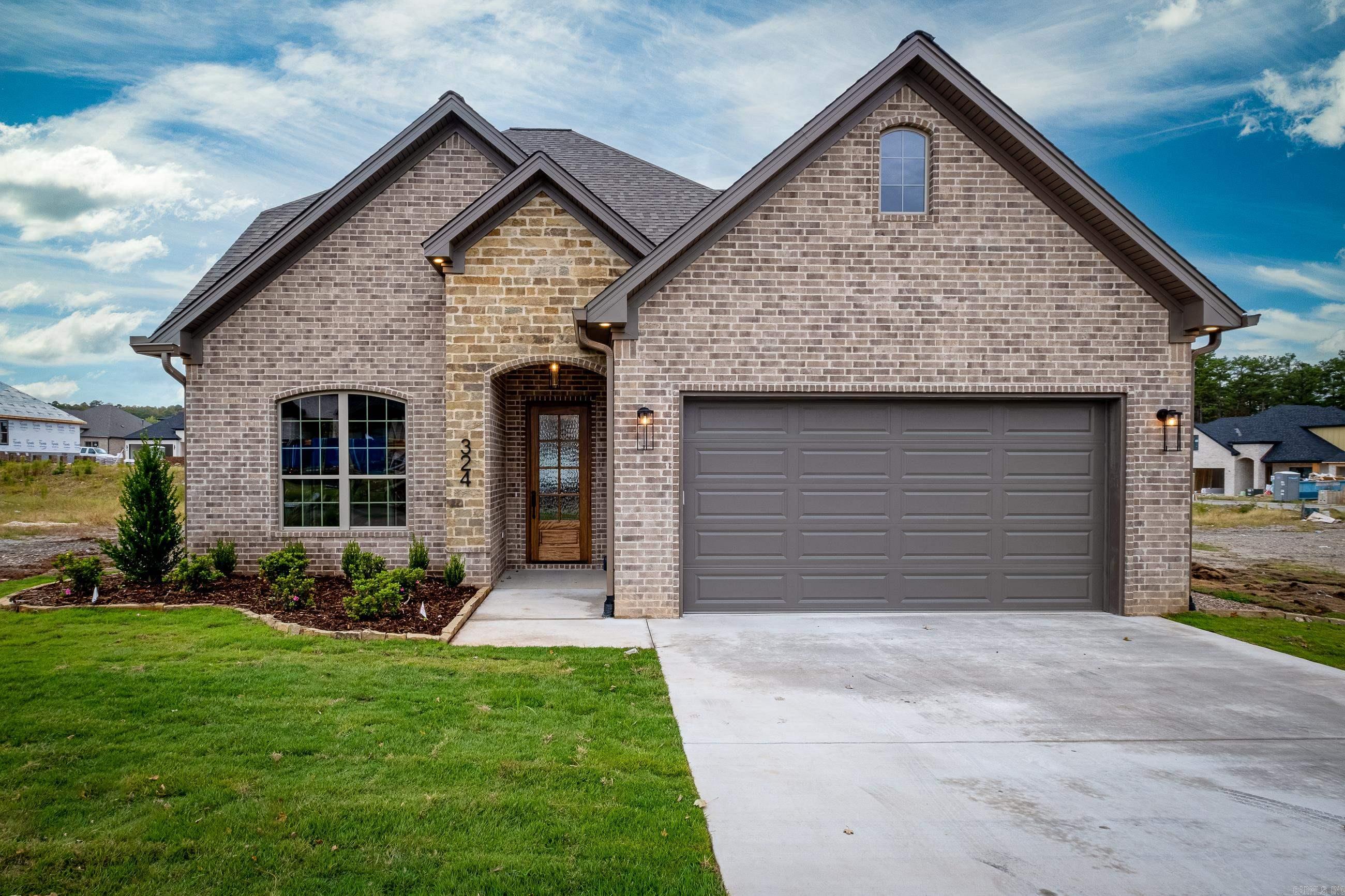 $5,000 Builder credit towards rate buy-down and/or closing costs with approved offer! Come see this high style, low maintenance house with the backyard of your dog’s dreams! Excellent use of space throughout with the primary bedroom plus one additional on the main level. The fireplace acts as the focal point for the open living space featuring a true vaulted ceiling making the home feel spacious and inviting. From the garage entry, pass through the mud room to a spacious beverage bar across from the pantry.   Upstairs provides an additional bedroom and bathroom.  The outdoor covered patio offers additional space complete with wiring for your outdoor television and gas for your grill!