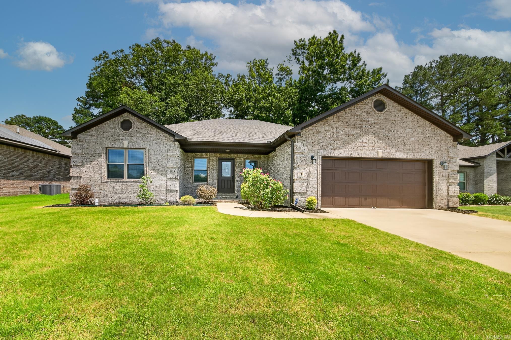 Welcome to Autumn Brooke Estates! This beautiful 4-bedroom, 2-bath home offers a spacious and functional layout with no carpet throughout. The inviting living room features an electric fireplace with a stylish tile surround and stained wood mantel, creating the perfect focal point for gathering with family and friends. The kitchen is designed for both everyday living and entertaining, featuring a large island with breakfast bar seating, granite countertops, tile backsplash, stainless steel appliances, and an eat-in dining area. A generously sized laundry room with ample cabinet storage adds convenience and functionality. The primary suite is a relaxing retreat with a tray ceiling, spacious walk-in closet, double sink vanity, separate tub, walk-in shower, and abundant cabinet storage. Step outside to enjoy the large covered back patio overlooking the fenced backyard, providing plenty of space for outdoor entertaining, pets, or play. Don't miss your opportunity to make this move-in ready home yours!
