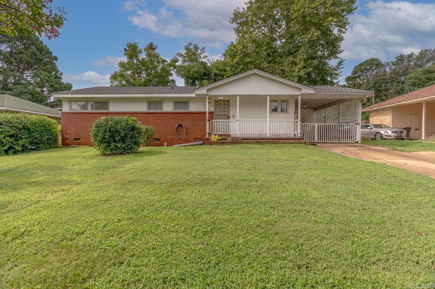 Welcome to Market 723 Valley Dr. in Jonesboro, AR within the Jonesboro School District. Situated on .25± acres in Midtown, this 1,288 sf ranch style home offers 3 bedrooms, 1 full bath, and 1 half bath. The exterior is wrapped in brick & vinyl and topped w/ 2024 architectural shingles, accented by a covered front porch, gutters, and a covered 1-car carport w/ storage room. Inside, you’ll find a spacious living room w/original hardwood floors, an eat-in kitchen w/ tile floors, painted cabinetry,  stainless appliances, ample counter space, and a dedicated laundry room. The primary bedroom offers a private half bath, while 2 spare bedrooms and an updated full bath w/ tiled walk-in shower complete the interior. Outside, the fully fenced backyard includes mature shade trees, a garden area, patio, and 2 storage buildings, including a newer 12x8 shed. Additional features include fiber internet, a sealed crawl space w/ ATMOX system, dehumidifier, sump pump, and floored attic storage. Conveniently located near favorite local amenities w/ easy access to 49 S and Interstate 555 Call today to make this house your home or next addition to your rental portfolio.