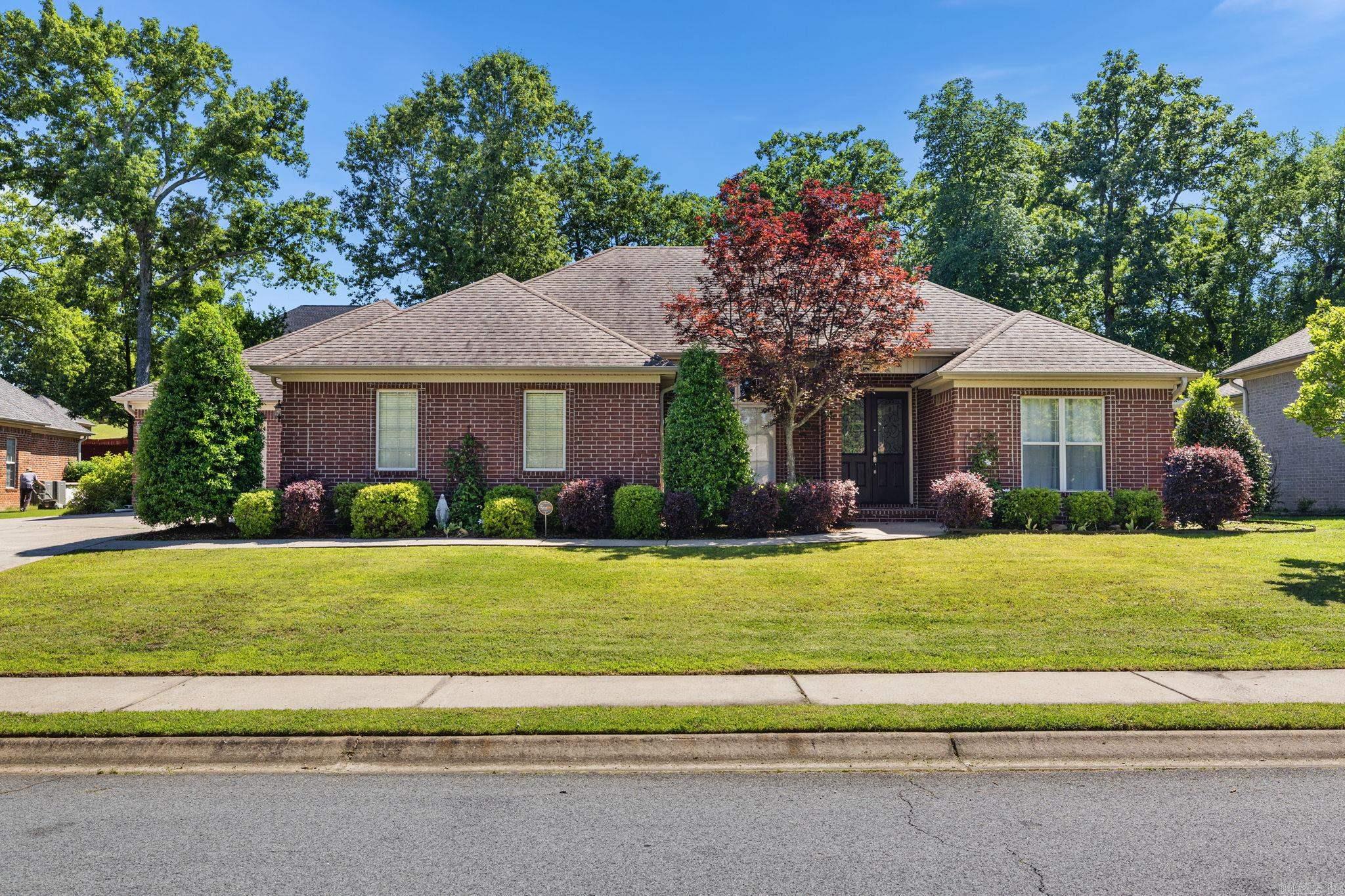 Beautiful brick home in Miller’s Crossing offering 4 bedrooms, 2.5 baths, and a 3-car garage. A grand double-door entry welcomes you into a warm, well-appointed interior featuring new interior paint, wood interior doors, updated countertops, crown molding, large baseboards, and detailed trim accents. Recent updates include new tile on the fireplace surround and new tile flooring. The primary suite also offers a jetted tub and a large walk-in closet with built-ins. Enjoy outdoor living with a large rock patio and sidewalk, sprinkler system, iron-gated fencing on both sides, floored attic storage, and a garage floor with a QuickCrete finish. Come see this gorgeous home today!