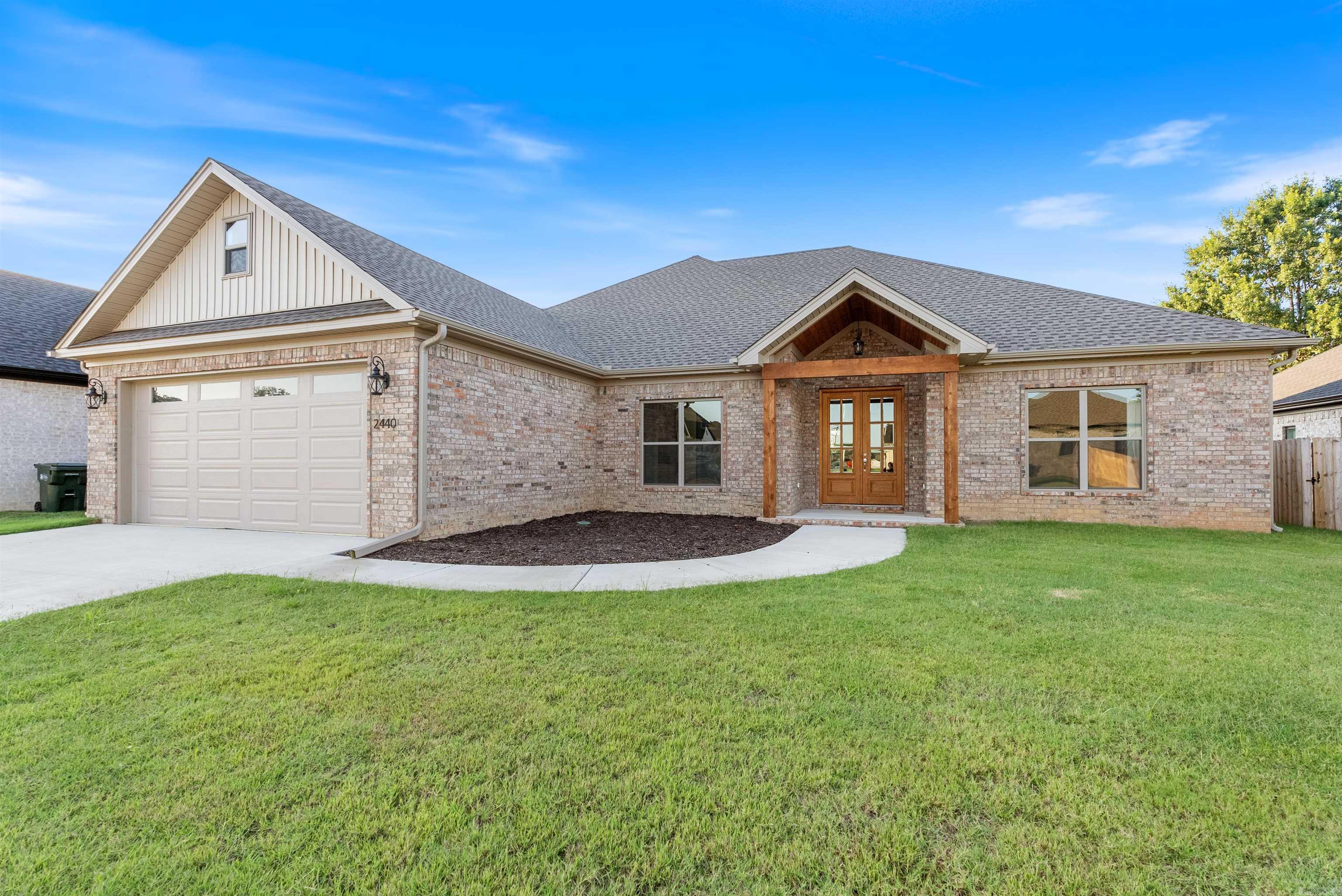Stunning newly constructed residence in Southwest Conway featuring 4 bedrooms, 2 bathrooms, luxury finishes, and only a half mile walk to Ellen Smith Elementary. This home includes top-of-the-line appliances, a pot filler above the gas cooktop, quartz countertops, a luxurious soaking tub, and a walk-in shower. An oversized garage boasts a specific stairway leading to the attic, coupled with gutters installed around the entire perimeter of the house. Enjoy the expansive covered patio, additional valley guards, an insulated garage, extra rebar in foundation, interior main water shut off, and a hot water circulation pump ensuring quick access to hot water. The interior walls are insulated for enhanced privacy and energy efficiency. The kitchen shines with a convection microwave, an extra-large island, and ample storage solutions. Additional highlights include extra electrical outlets throughout the property, ensuring convenience and functionality. Be sure to click the video links on your desktop for the 3D tour and aerial drone footage.