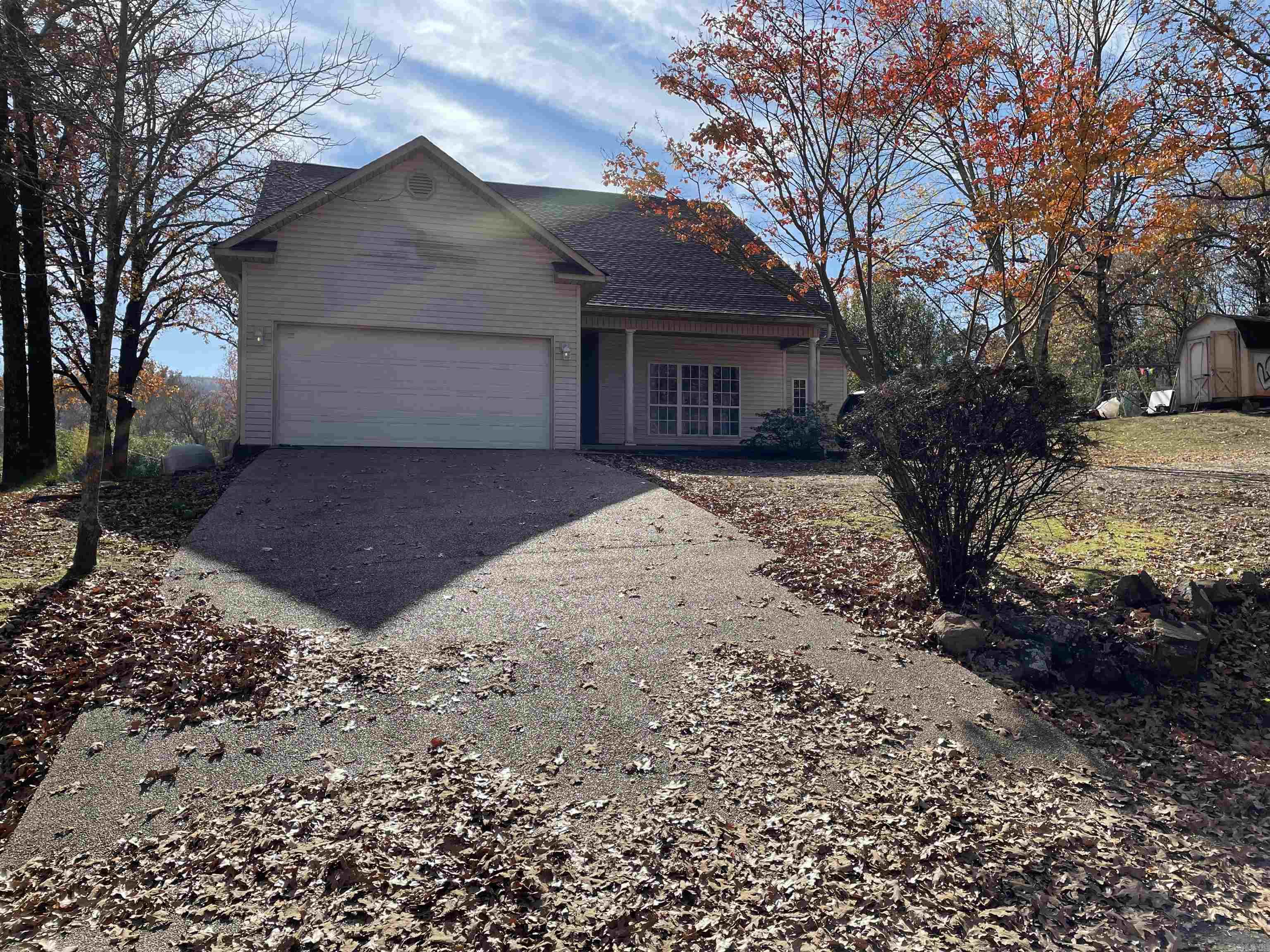 Cute house in the country, excellent neighborhood, corner lot, split floor plan, tile countertop, four bed, two bath, two car garage, new roof 2023, nice yard for garden, pets, and children. Storage building. Needs a little love! Selling as is! Lake Hamilton Schools.