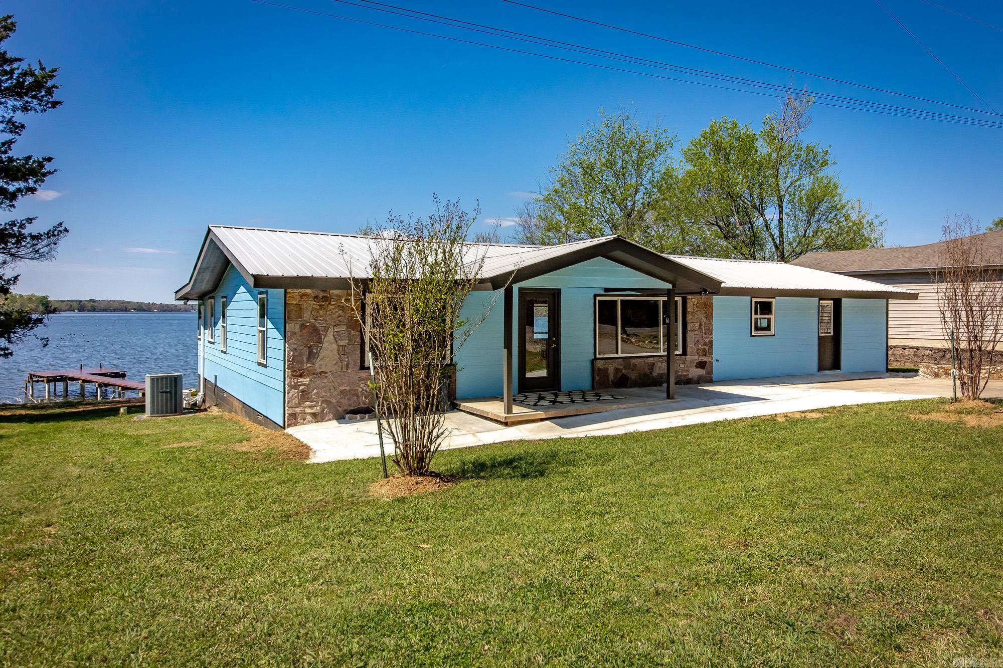 Its rare to find one w/ the view, privacy & the home itself all exceed expectations -but this one delivers on every level This completely renovated 3–4 bedroom 2.5 bath lakefront home offers modern living space on the quiet side of Harris Brake Lake-The home was taken down to the studs & rebuilt with new electrical-plumbing-insulation-septic system & energy-efficient windows The house is designed for energy efficiency:ensuring lower utility costs year-round for comfort Enjoy unobstructed panoramic lake views & some of the best sunsets imaginable Step outside to a 548 sq ft covered deck for entertaining & relaxing, then down to your 366 sq ft private dock w/ swim deck & graveled swimming beach for easy lake access Exterior is 100% Maintenance-Free w/ fiber cement James Hardie siding-rock accents & metal roof-Inside the open flexible layout allows for a 4th bedroom, office or bonus space Outdoor enthusiasts this is your location-Harris Brake has premier fishing & property is close to several Wildlife Management Areas offering thousands of acres for hunting, hiking & exploring - Full-time residence-weekend retreat or investment property this one checks ALL the boxes  A must come see!