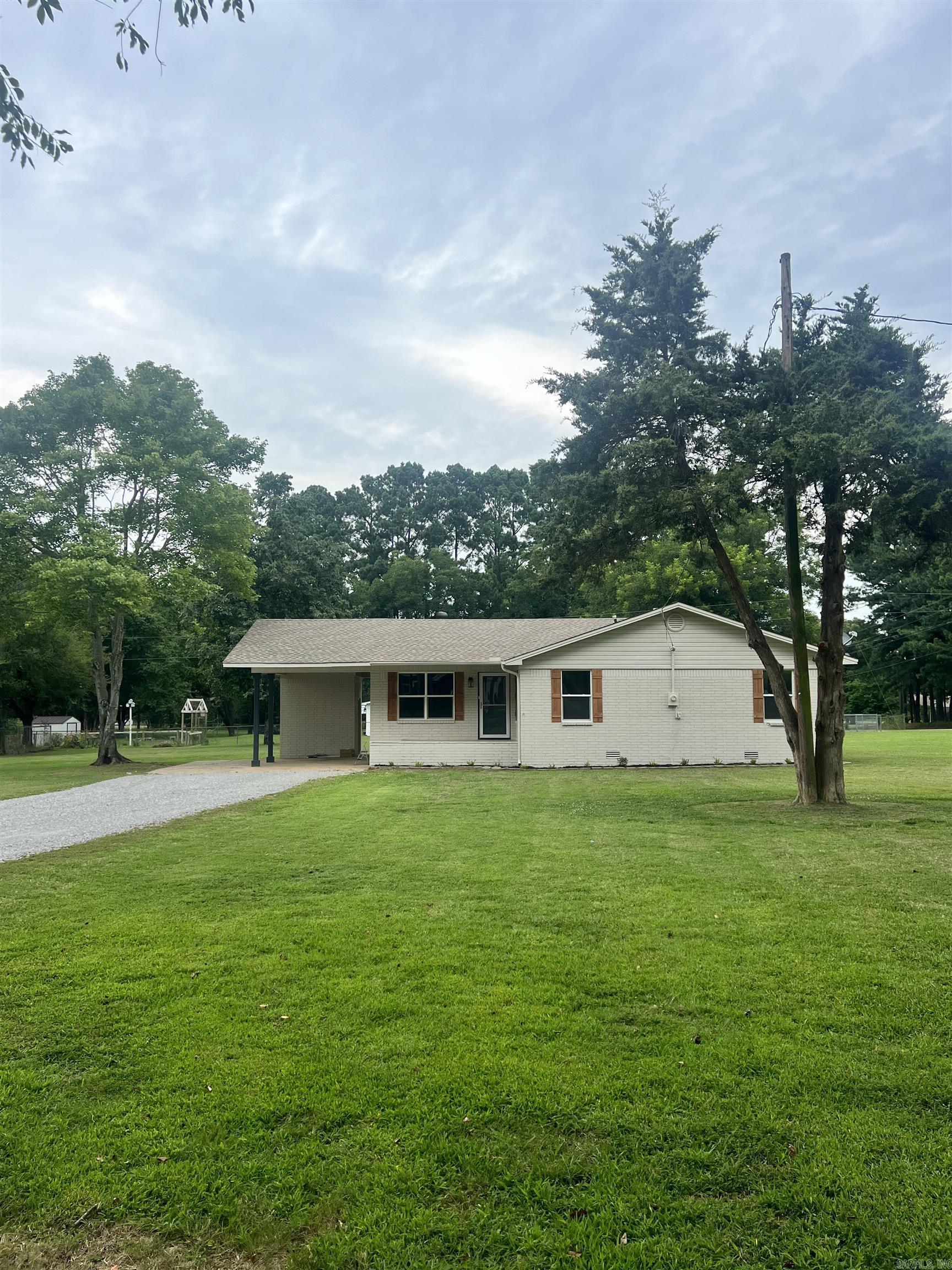 Completely remodeled home sitting on one acre on the West side of town! 3 bedrooms, 2 baths with a vaulted living room ceiling and a fireplace. New windows, granite countertops, new tile shower, luxury vinyl flooring, paint, appliances & more.