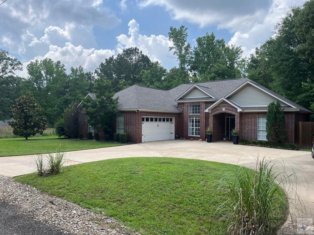 5.38 acres in the Genoa School District. Split bedrooms. Open floor plan. Breakfast bar, breakfast area and dining room. Den area features gas fireplace and exit onto a covered patio. Updated with quartz counter tops, new lavatories, bathroom faucets, light fixtures throughout. Beautifully landscaped with a small creek that runs through the back yard.