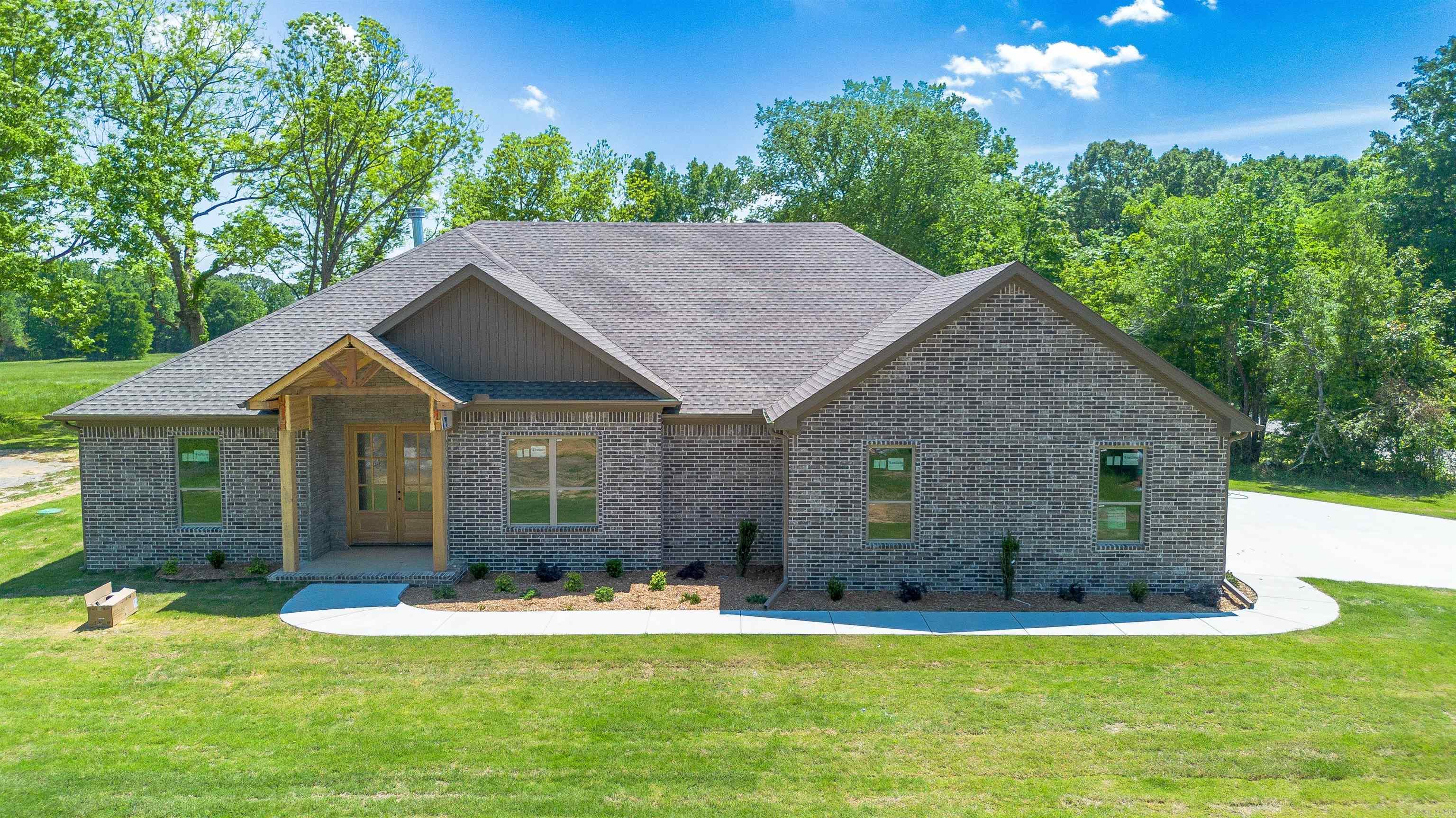 Welcome home to this 4 Bedroom / 2 Bathroom NEW CONSTRUCTION on 1.36 acres in the Cabot School District. Outside of city limits with NO restrictions with land, this is a rare to find home! More than enough room for a pool, shop, barn, and space for boats and toys.  The home boasts 2300 sqft of an open and split floor plan, high end finishes, tall ceilings, spacious closets and bedrooms, and a large primary bedroom and bathroom. Stone accents on the exterior, brick accent fireplace. Kitchen has plenty of storage, coffee bar, and walk in pantry. Side loaded garage. Additional driveway on the backside of property that would be a perfect spot for a shop or additional parking. Completion June 1st, 2026.