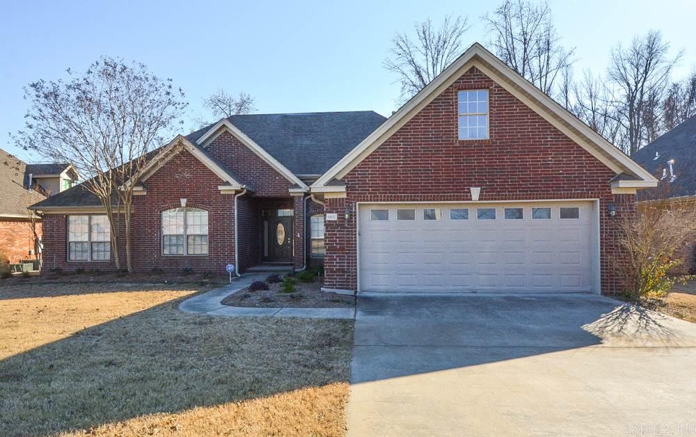 Look no further! This stunning 4 bedroom, 3 bath home backs right up to the lake! It has a great open floor plan that is perfect for entertaining for both indoors and out! Guest bedroom & full bath apart.  New paint & carpet throughout.   A dream kitchen with gorgeous tile work, solid surface counter tops, and a chef's pantry!  Large master bedroom w/sitting area and accessible to its own back deck.  Decks replaced in 2015.